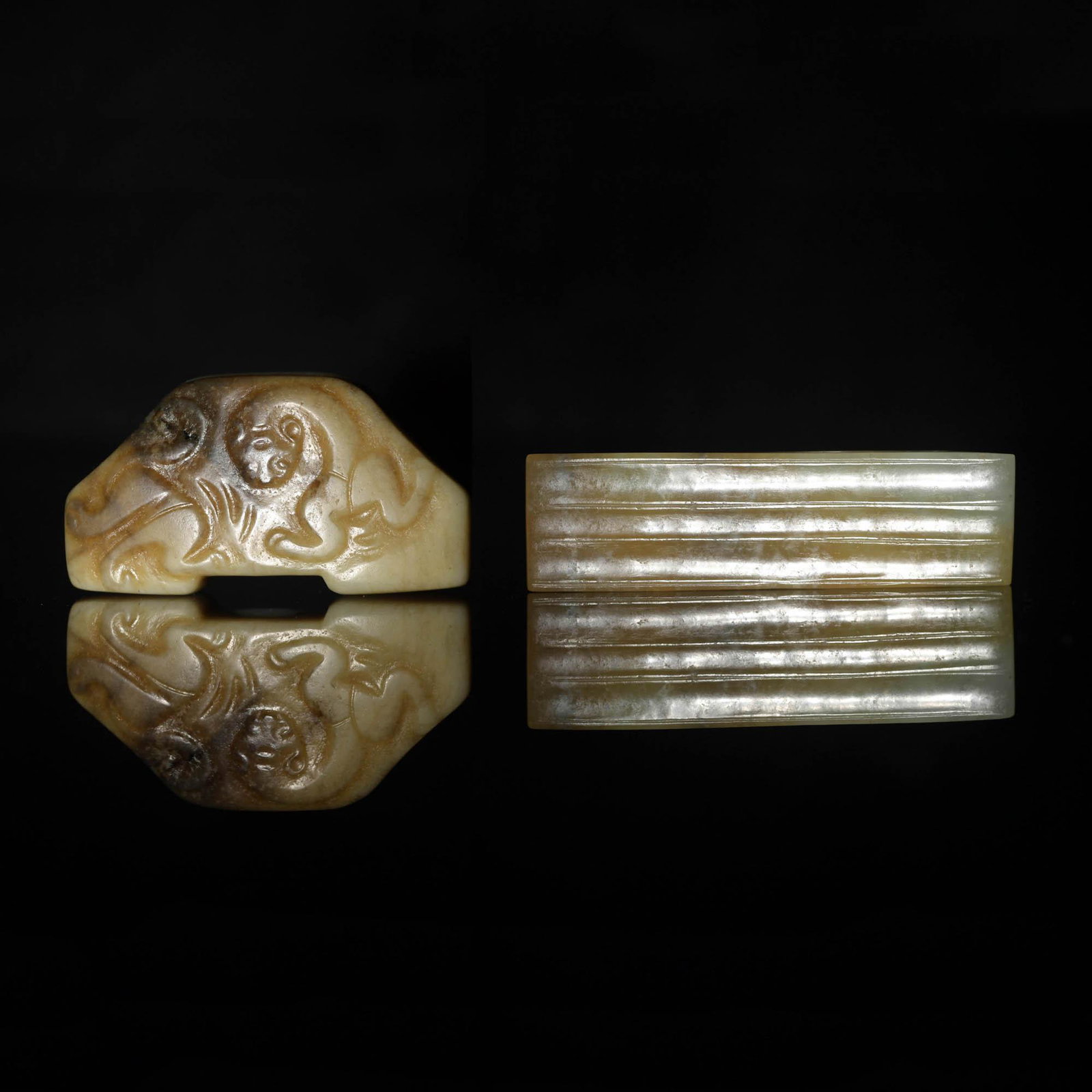 Two Chinese jade sword decorations, Ming dynasty or earlier: Two Chinese jade sword decorations Ming dynasty or earlier H: 3/4, W: 2 3/4 in. (rectangular jade) (H: 1.91, W: 6.99 cm. (rectangular jade)) Provenance: Mr. Yiu, Boston, Massachusetts. Acquired in Hon