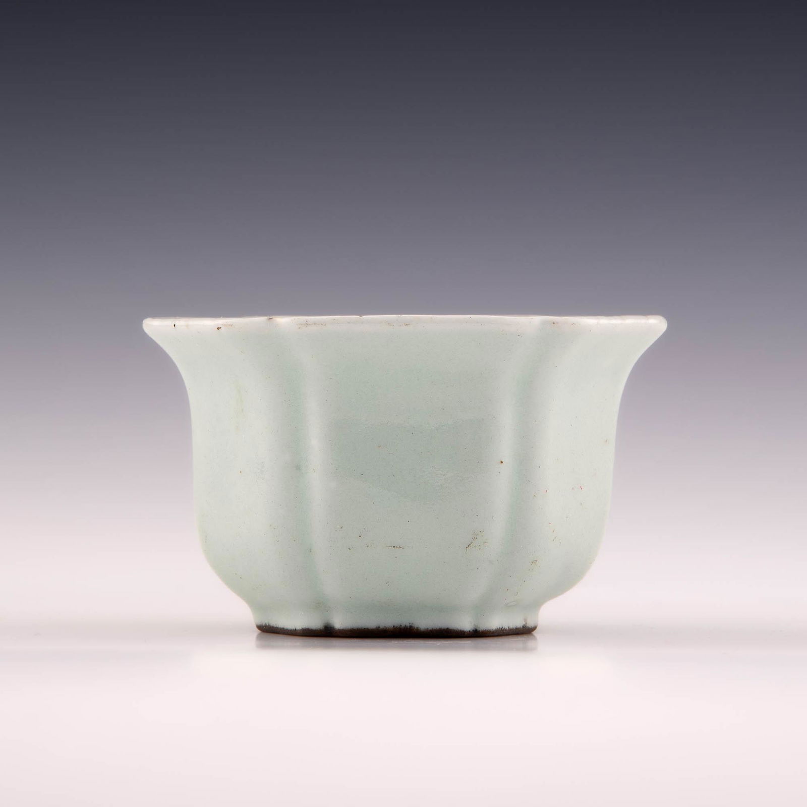 A Chinese celadon hexagonal cup, Qianlong period (1 of 8)
