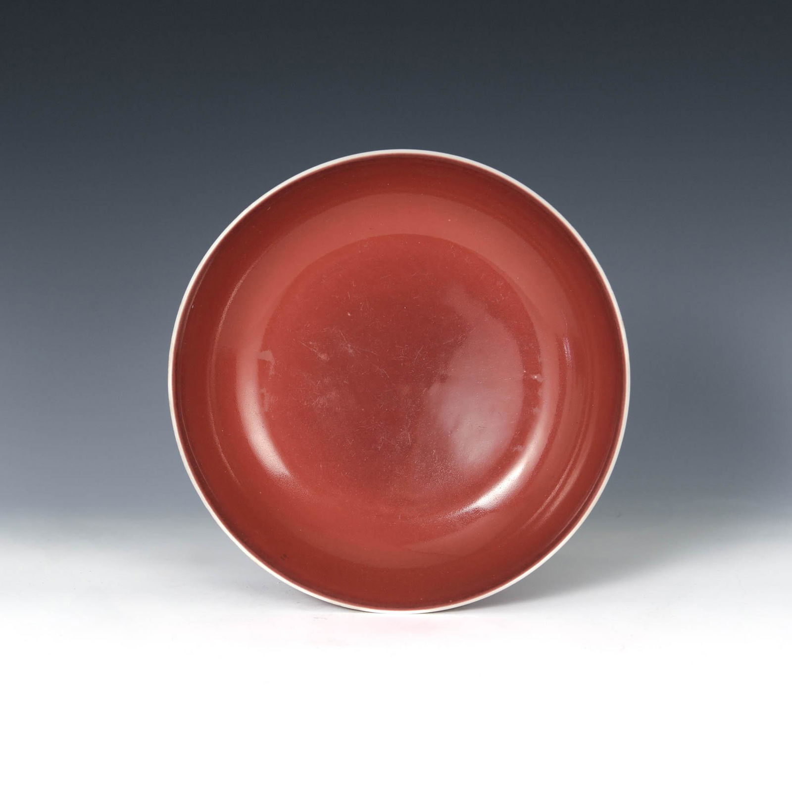 A Chinese copper red plate, Qianlong period (1 of 5)