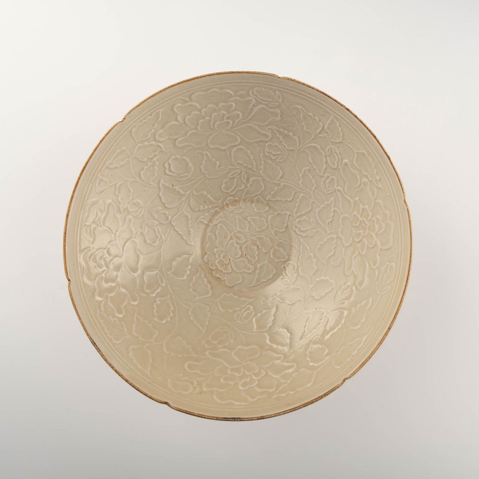 A Chinese white-glazed lobed bowl, Song or Yuan dynasty (1 of 5)