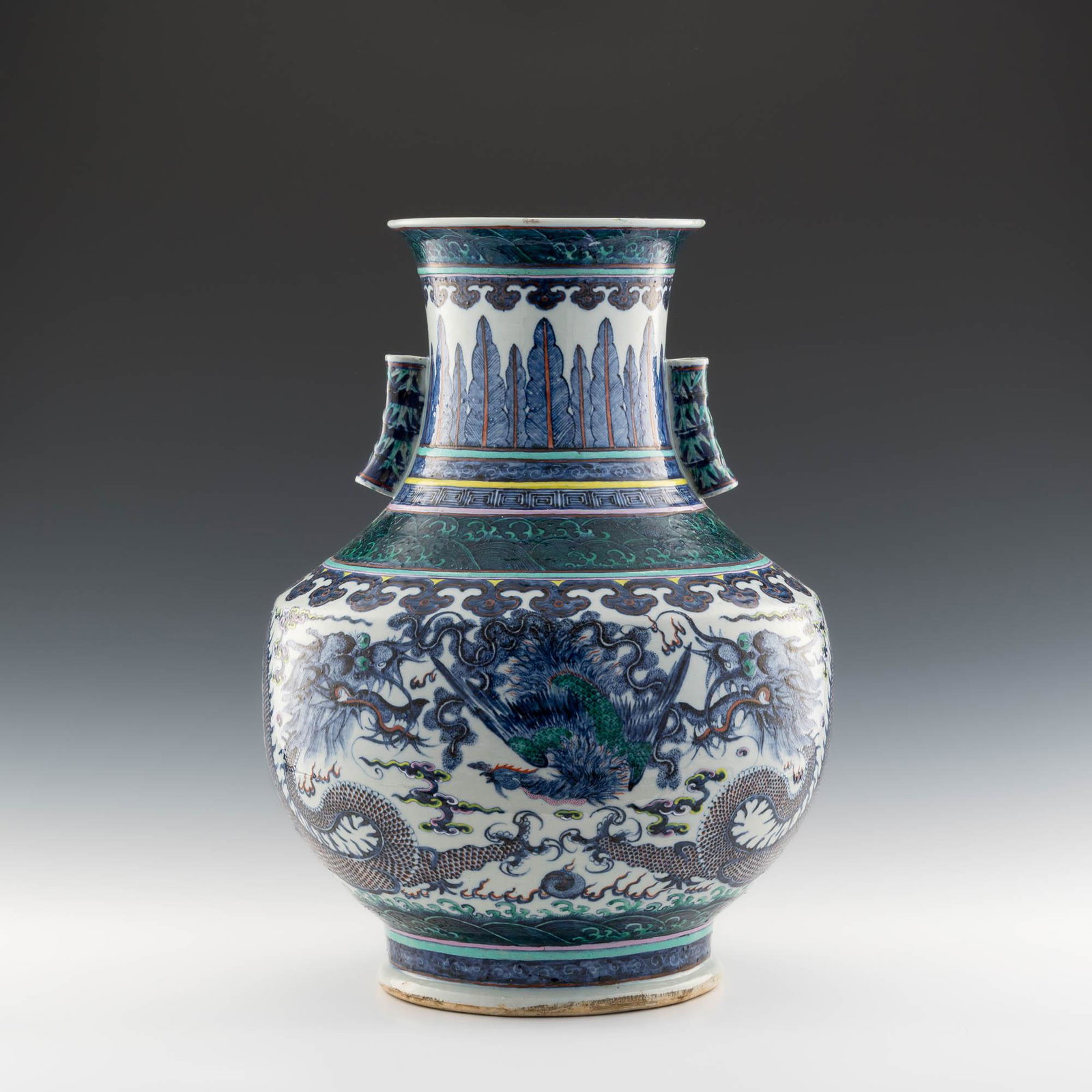 A Chinese doucai dragon and phoenix Zun, 19th century: A Chinese doucai dragon and phoenix Zun 19th century H: 22, Dia: 15 1/2 in. (H: 55.88, Dia: 39.37 cm.) Provenance: Mrs. Yue, California. A family heirloom shipped from Hong Kong to US in the 1980's.