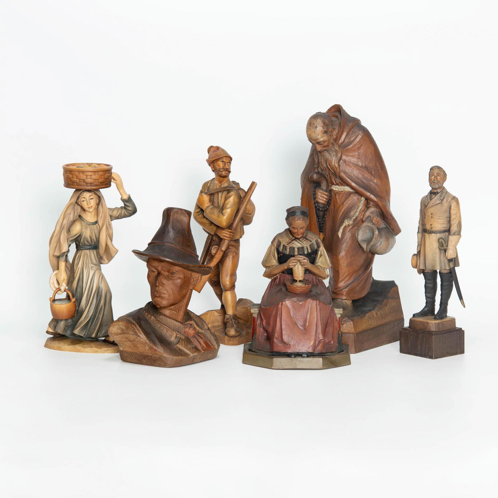 Six hand carved and painted wood figures, Anri; Albert Petitto (Robert E. Lee); M.K. Kaslatter: Six hand carved and painted wood figures Anri; Albert Petitto (Robert E. Lee); M.K. Kaslatter (seated figure); 20th century Includes a figure of Robert E. Lee plaque to underside that reads: "Robert E
