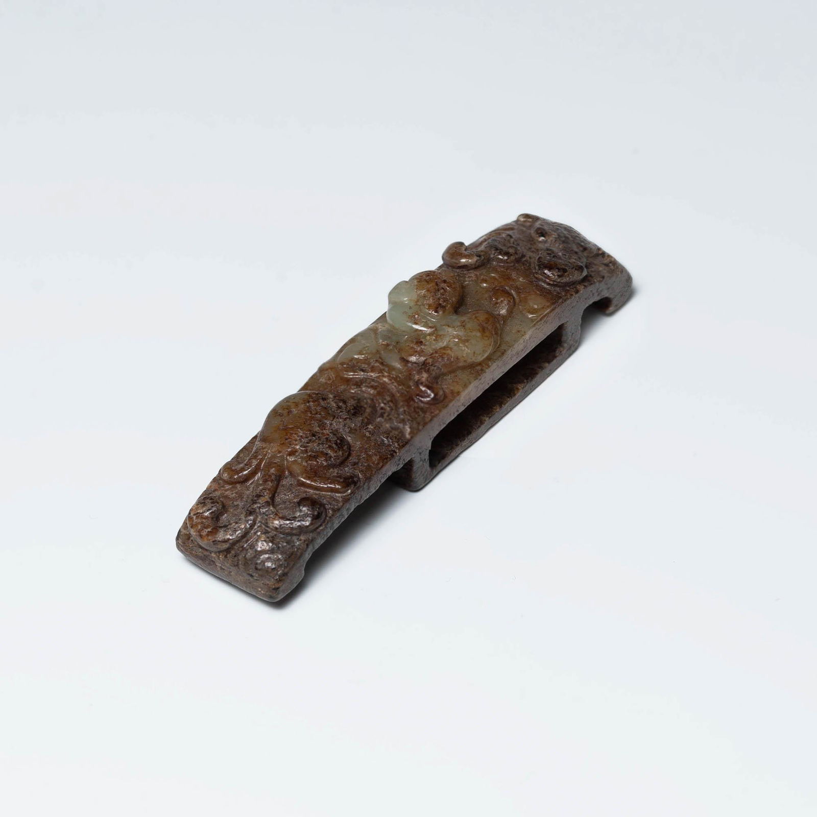A Chinese carved jade sword handle, Ming dynasty or earlier (1 of 7)