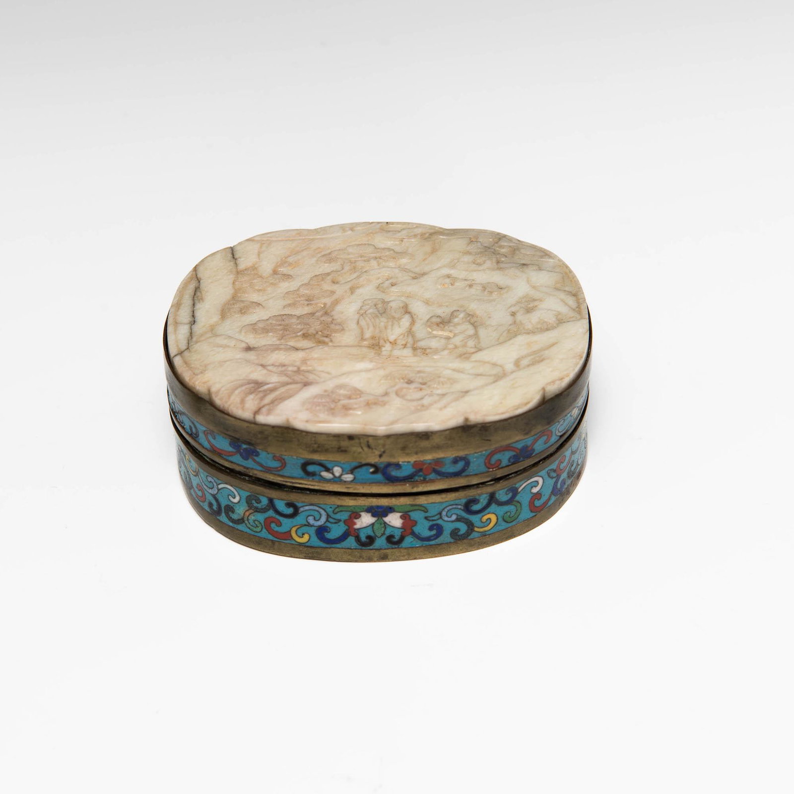 A Chinese cloisonne box with carved chicken bone jade plaque, 18th century: A Chinese cloisonne box with carved chicken bone jade plaque 18th century H: 1 3/4, W: 4 1/2, D: 3 5/8 in. (H: 4.45, W: 11.43, D: 9.21 cm.) Provenance: Mr. Quinn, Ohio. Inherited from his uncle.