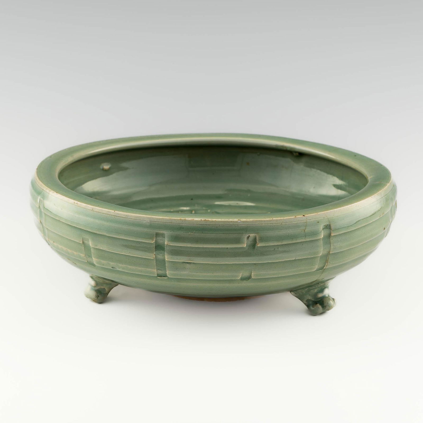 A Chinese Longquan celadon tripod censer, Ming dynasty (1 of 8)