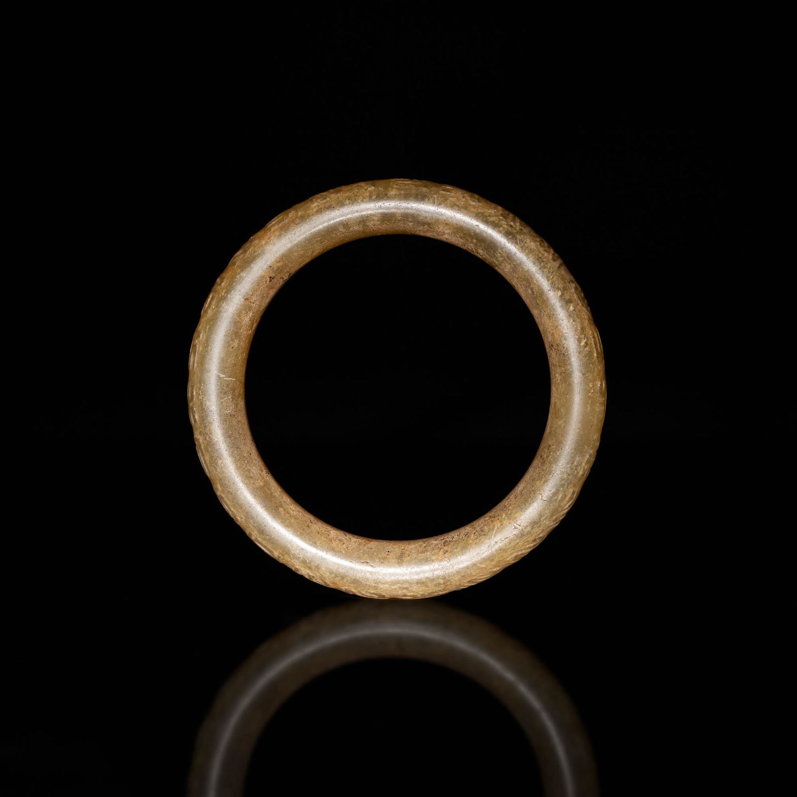 A Chinese yellow jade bangle, Ming dynasty or earlier (1 of 5)