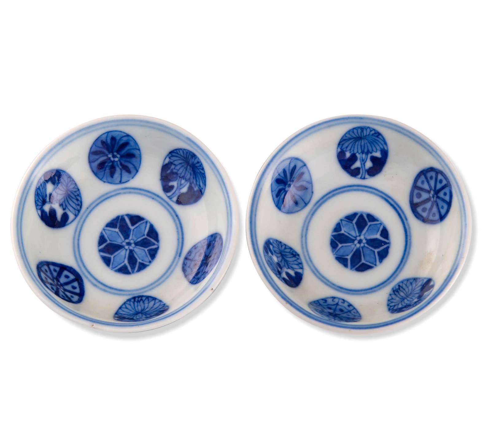 A pair of Chinese blue and white round flower dishes, Jianqing period: A pair of Chinese blue and white round flower dishes Jianqing period With six-character Jianqing mark to undersides. (2). H: 1, Dia: 3 1/8 in. H: 2.54, Dia: 7.94 cm. Provenance: Collection of Mr. Shim