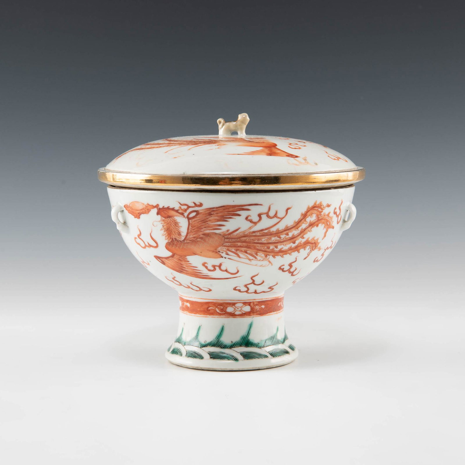 A Chinese iron red three-part food warmer, late 19th century: A Chinese iron red three-part food warmer late 19th century Comprising a lid, bowl, and warming pot. Lid with dragon and phoenix chasing a flaming pearl to exterior and gilt beast finial. Bowl with gi