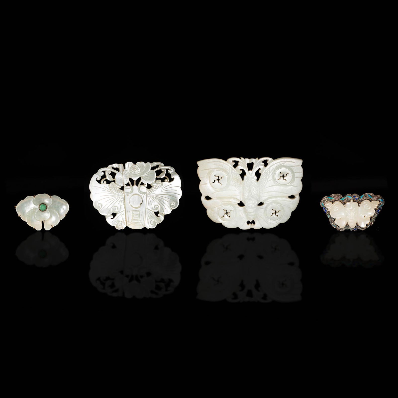 A group of four Chinese butterfly and flower jades, 18th/19th century (1 of 5)