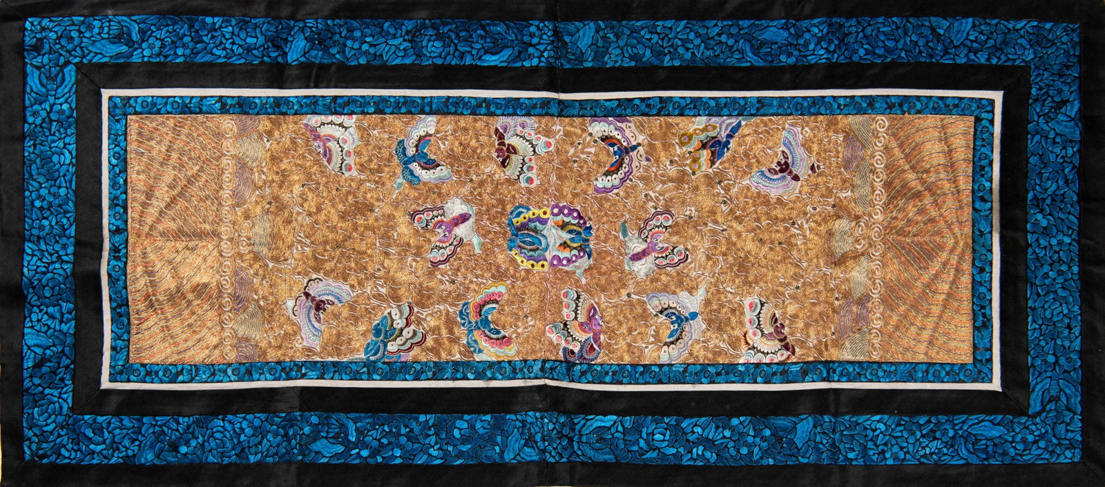 A Chinese butterfly embroidery, 19th century: A Chinese butterfly embroidery 19th century With goldwork background surrounding multi-colored butterflies. H: 33 1/4, W: 14 7/8 in. H: 84.45, W: 37.78 cm. Provenance: Private collection, Palm Springs