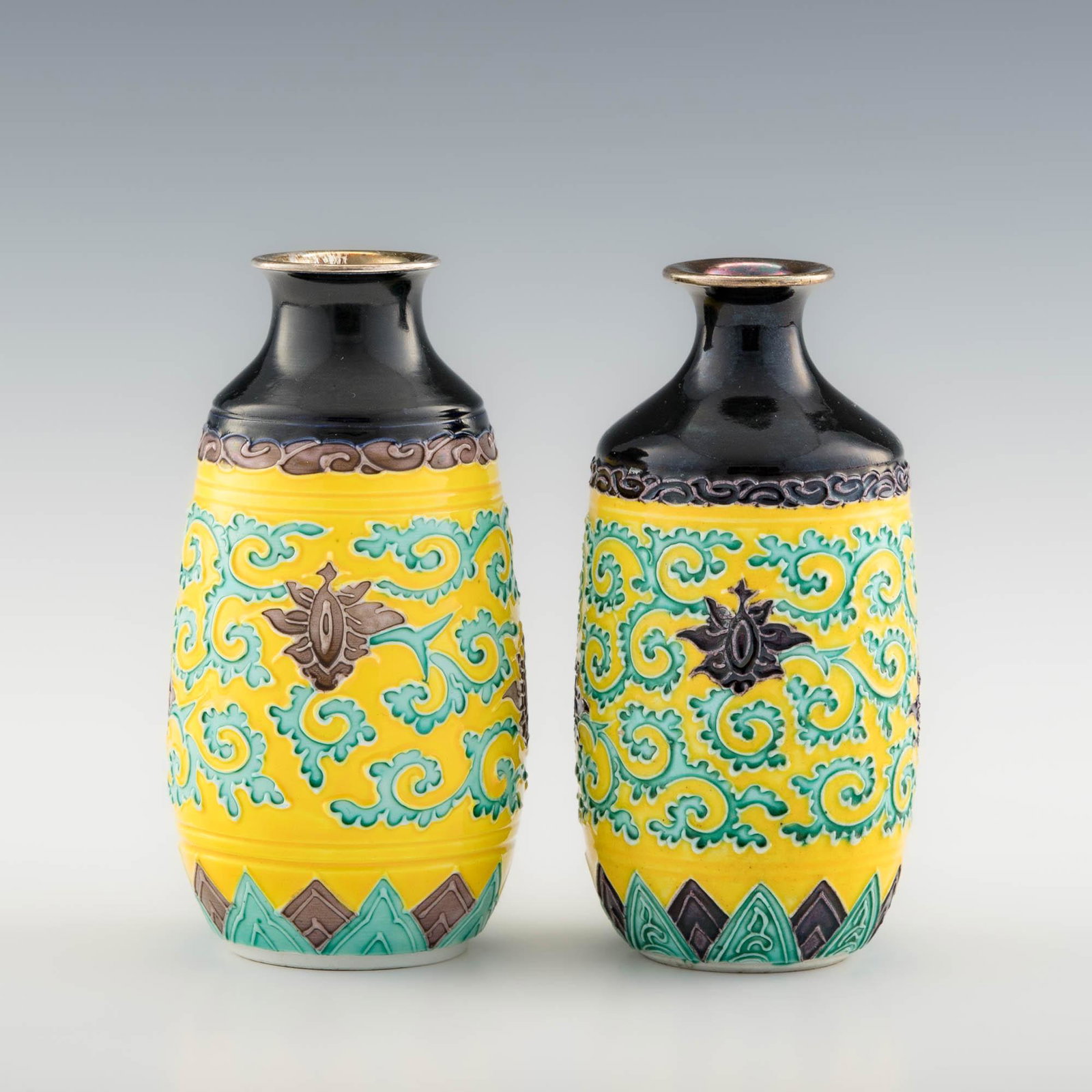 Two Japanese Eiraku porcelain vases with silver rims, Meiji era: Two Japanese Eiraku porcelain vases with silver rims Meiji era Both with a six-character mark to foot. H: 5, Dia: 2 5/8 in. (largest) H: 12.7, Dia: 6.67 cm. (largest) Provenance: Private collection, P