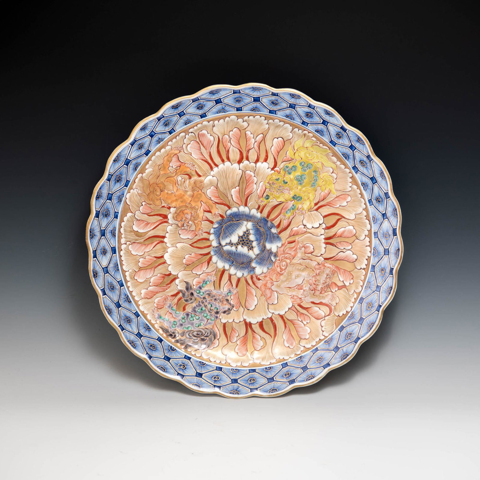 A Japanese Imari charger, probably Meiji era: A Japanese Imari charger probably Meiji era With foo and floral motifs. Marked "FuKi Choshun", (Wealth, Nobility, Longevity and Youth), a mark used mostly during the Meiji era. H: 2, Dia: 16 3/8 in. H