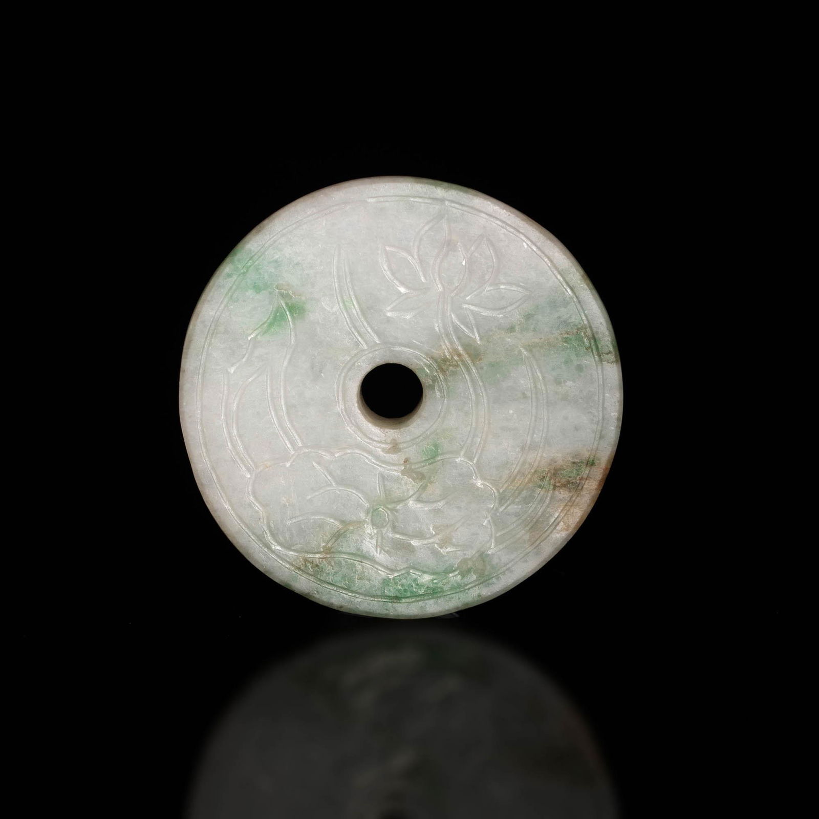 A Chinese jadeite bi with lotus engraving, 19th century (1 of 3)