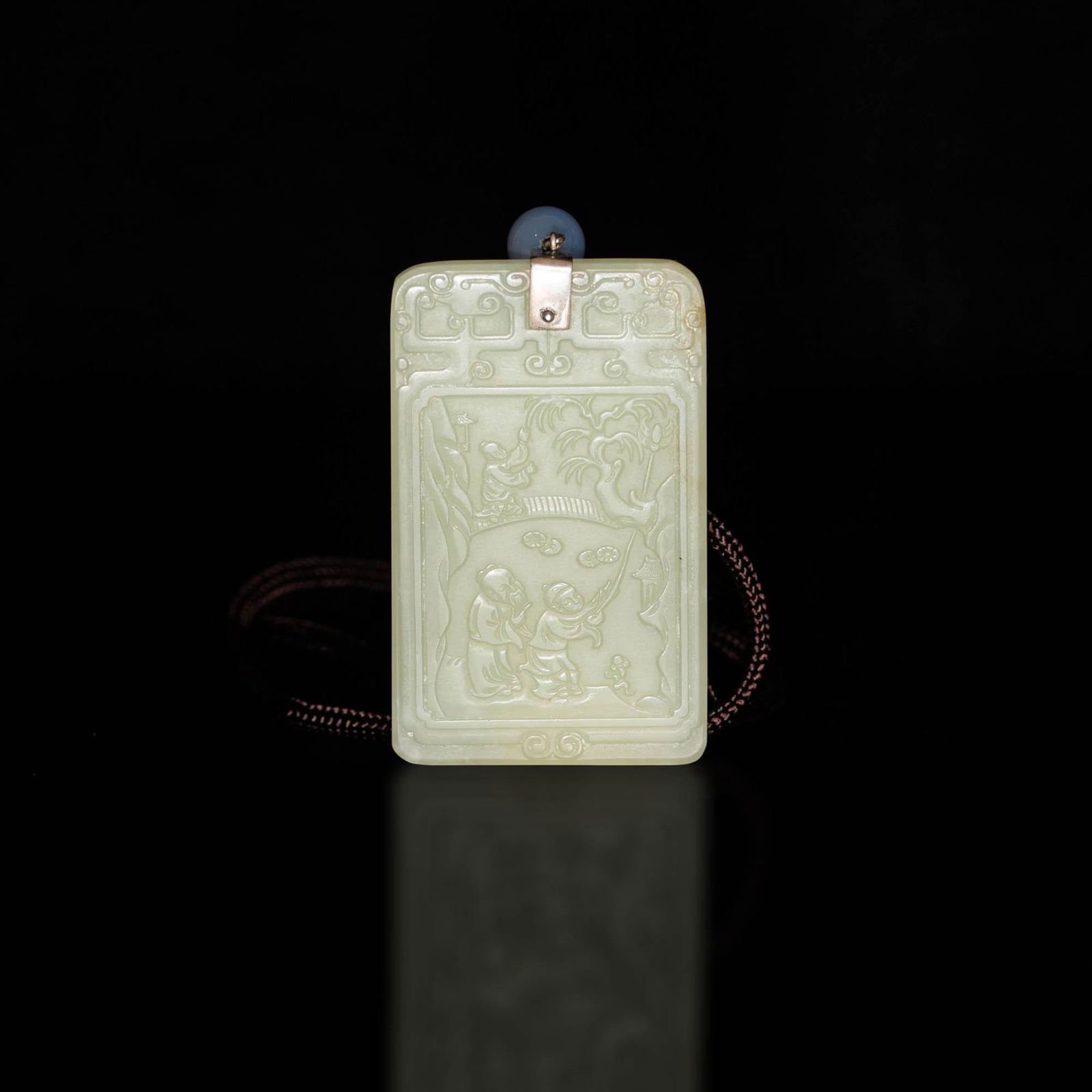 A Chinese jade figural plaque with inscription (1 of 3)