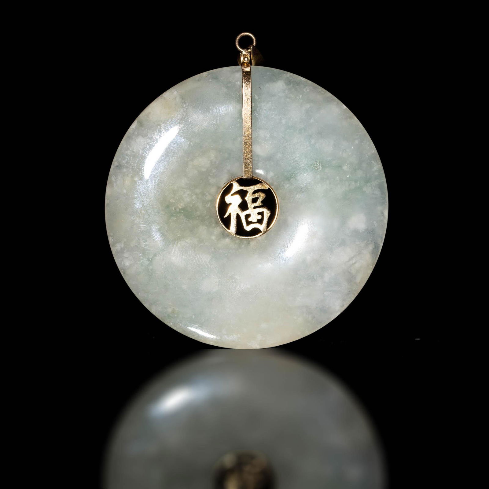 A Chinese jadeite bi: A Chinese jadeite bi Dia: 2 in. Dia: 5.08 cm. Provenance: Private collection, Pennsylvania. Click here for high resolution images.