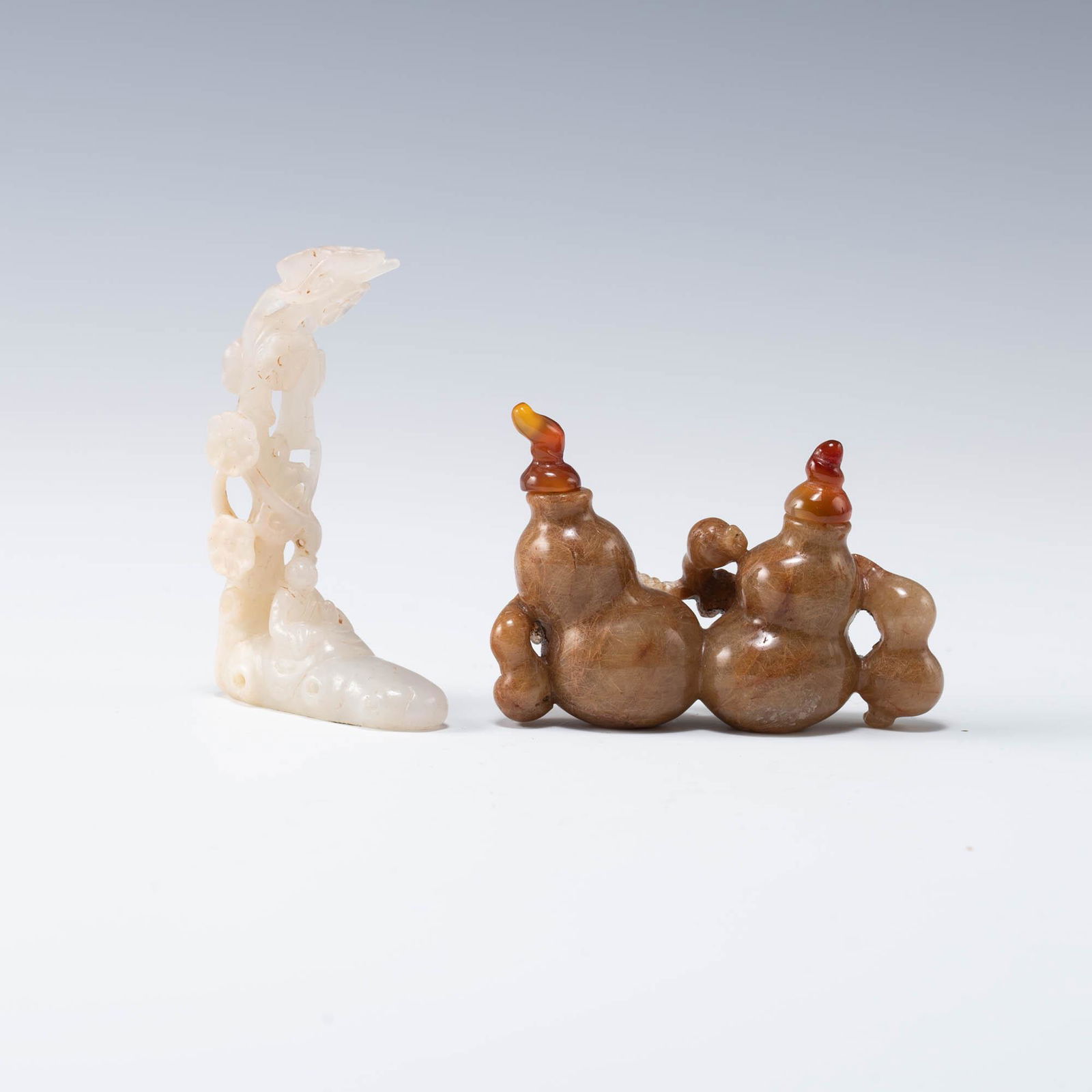 A Chinese carved white jade figure and a carved stone snuff bottle (1 of 5)