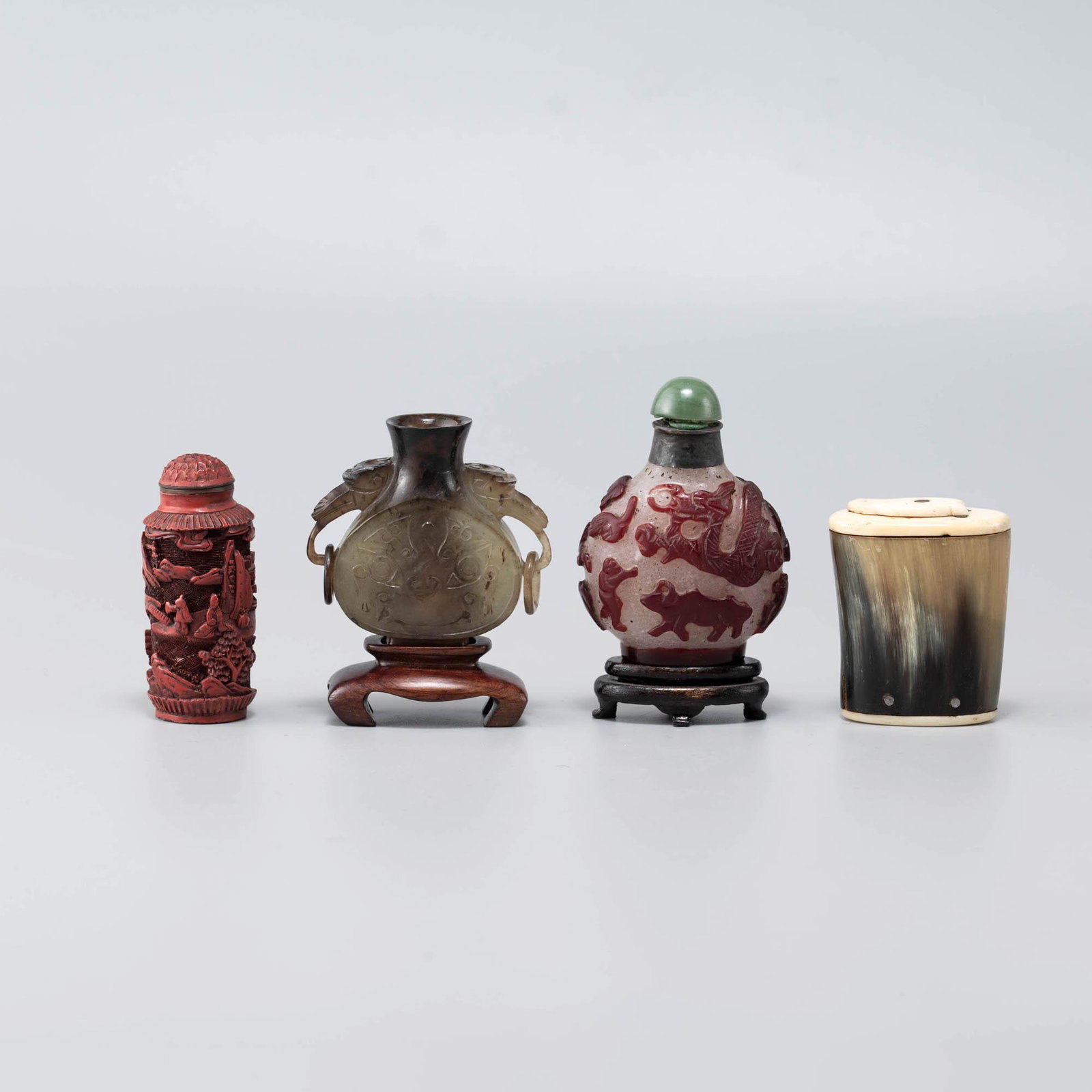 A group of four Chinese snuff bottles: A group of four Chinese snuff bottles H: 2 7/8, W: 2 1/8 in. H: 7.3, W: 5.4 cm. (largest) Provenance: Private collection, Washington D.C. Click here for high resolu