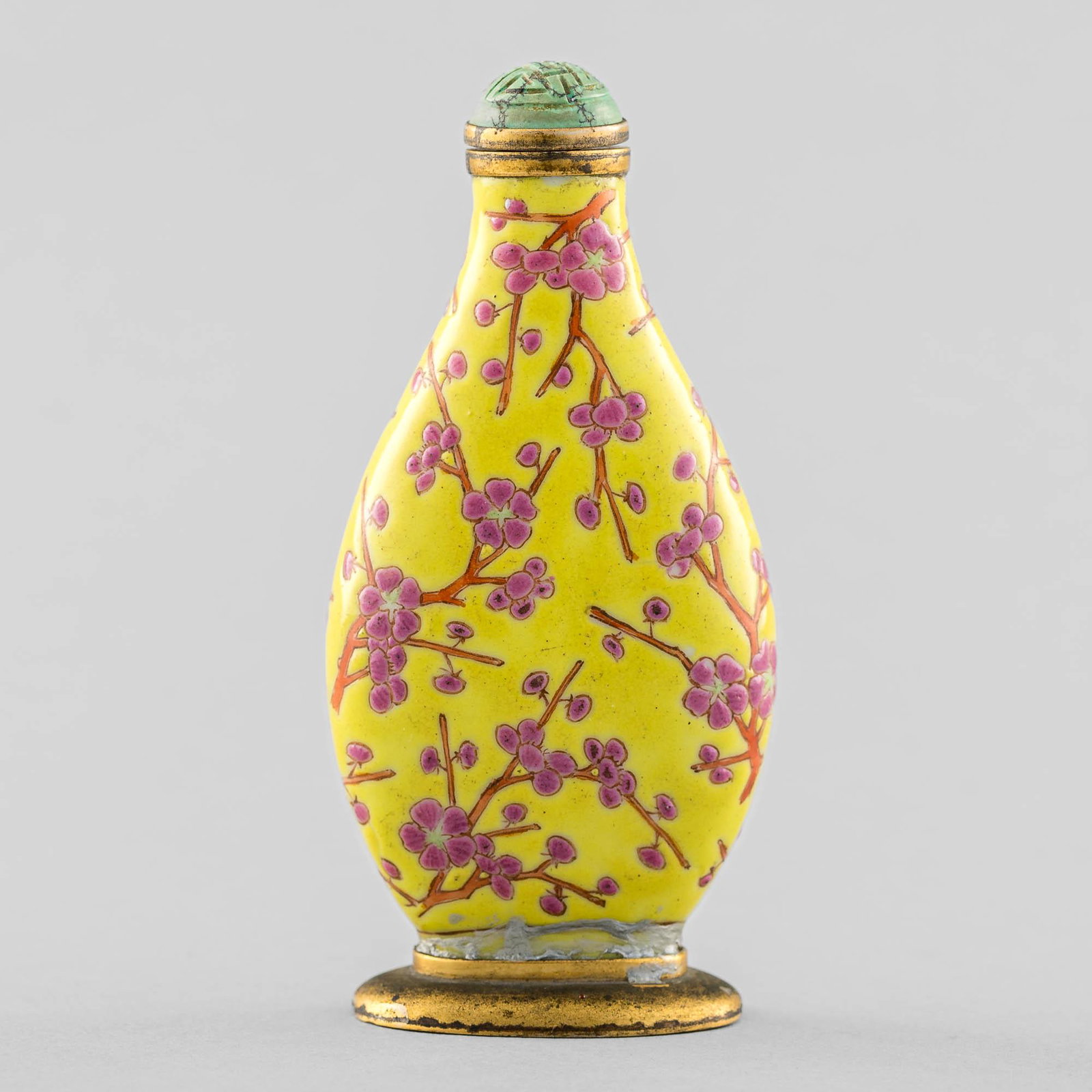 A Chinese yellow-ground famille rose snuff bottle, 19th century: A Chinese yellow-ground famille rose snuff bottle 19th century Fitted with metal rim and secured to metal stand. H: 3 7/8, W: 1 7/8 in. H: 9.84, W: 4.76 cm. Provenance: Private collection, New York Ci