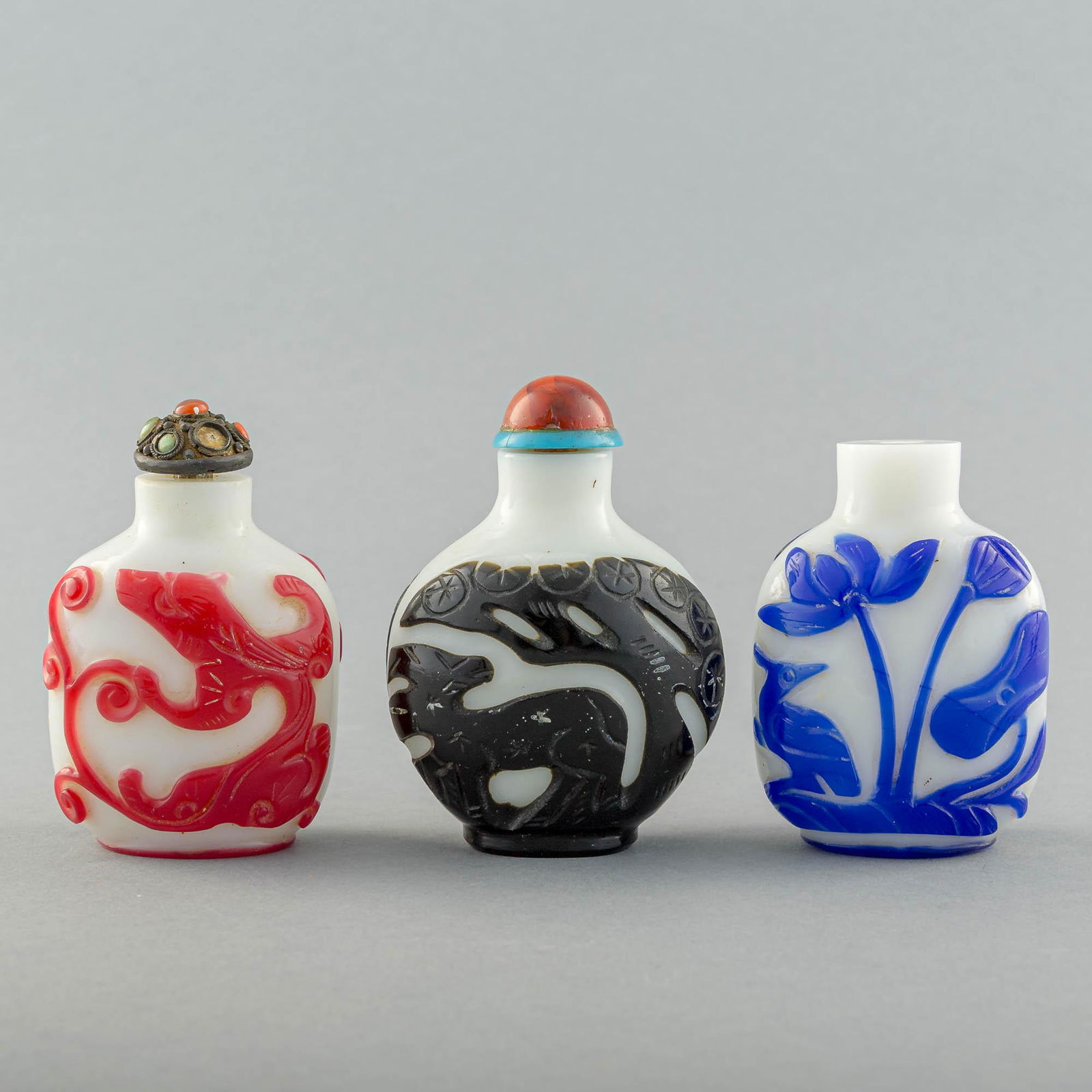 Three Chinese Peking glass snuff bottles with overlay, 19th century (1 of 12)