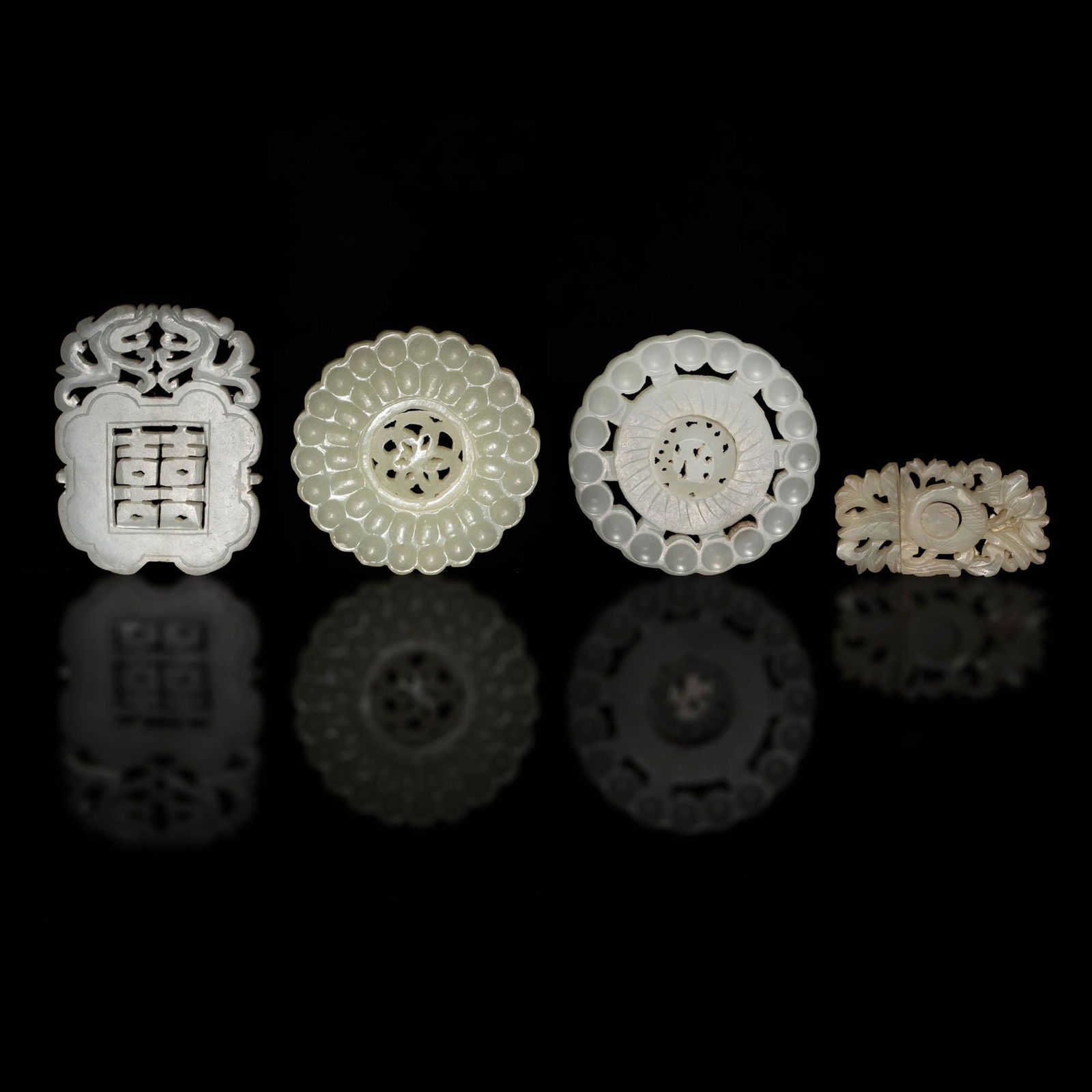 A group of four Chinese jade carvings, Ming-Qing dynasty (1 of 3)