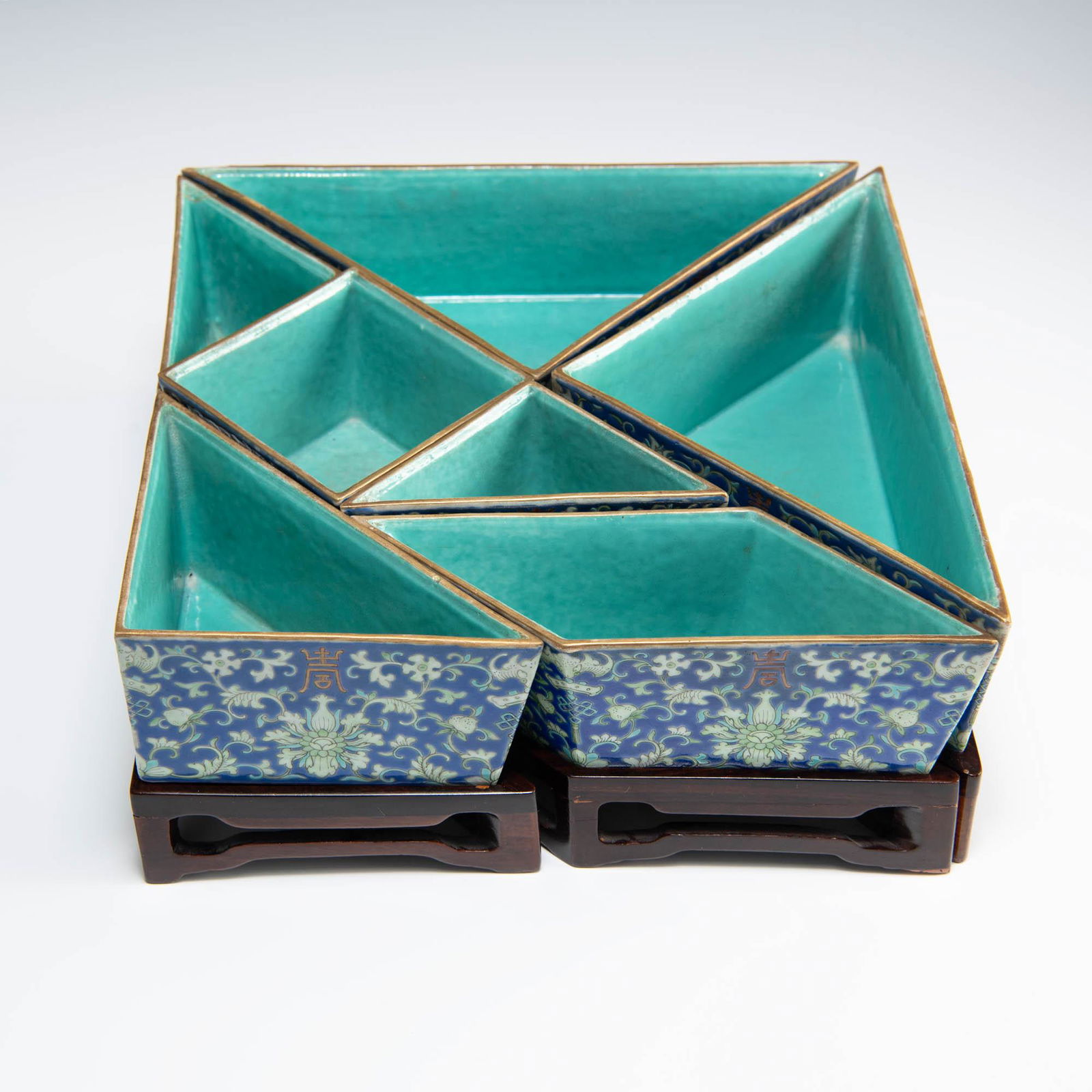 A Chinese set of seven blue-ground famille rose dishes, 19th century (1 of 10)