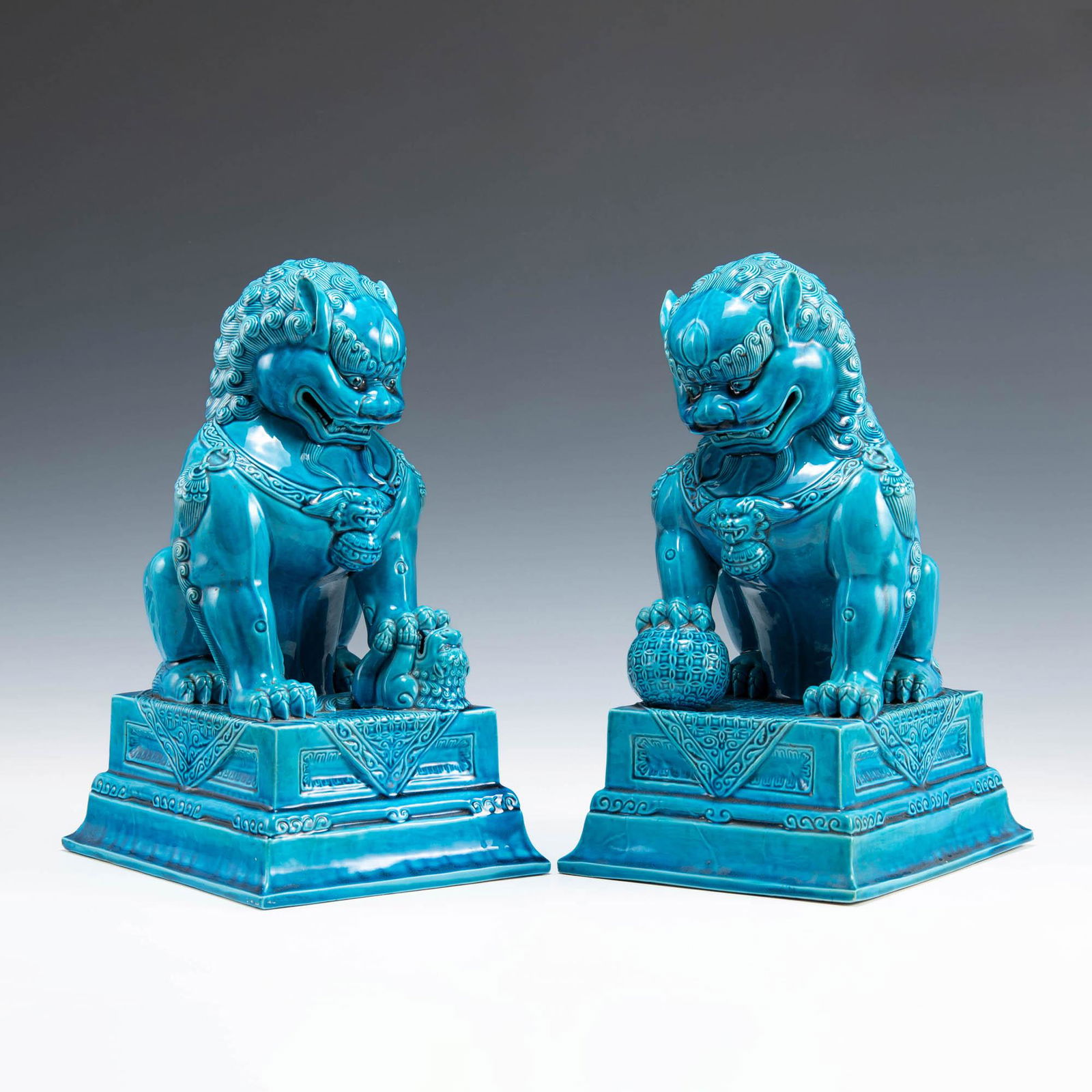 A pair of Chinese turquoise-glazed guardian lions, late 19th century (1 of 9)