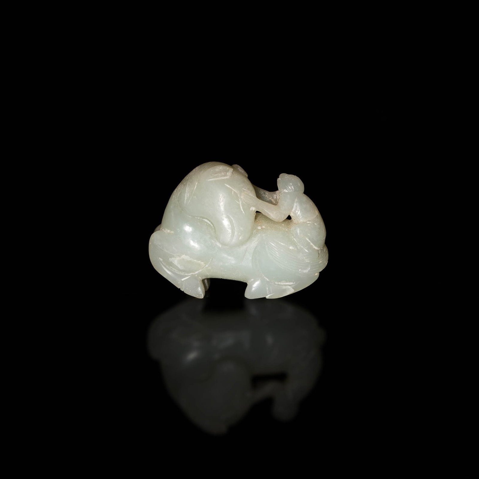 A Chinese carved white jade monkey on a horse toggle, 18th/19th century: A Chinese carved white jade monkey on a horse toggle 18th/19th century H: 1 5/8, W: 2 1/4, D: 7/8 in. H: 4.13, W: 5.71, D: 2.22 cm. Provenance: Mr. Lau, Honolulu, Hawaii. Acquired in Hong Kong in the 
