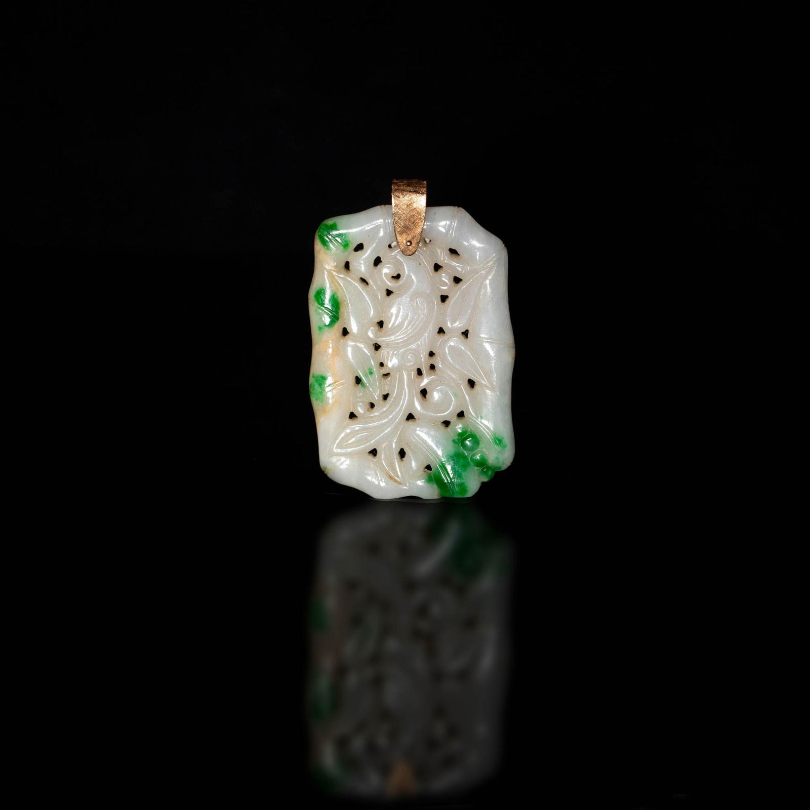 A Chinese carved jadeite plaque, 19th century: A Chinese carved jadeite plaque 19th century Centering a elegant bird framed in bamboo stalks and foliage. H: 2 1/4, W: 1 1/2, D: 1/8 in. H: 5.71, W: 3.81, D: 0.32 cm. Provenance: Mrs. Zak, Big Island