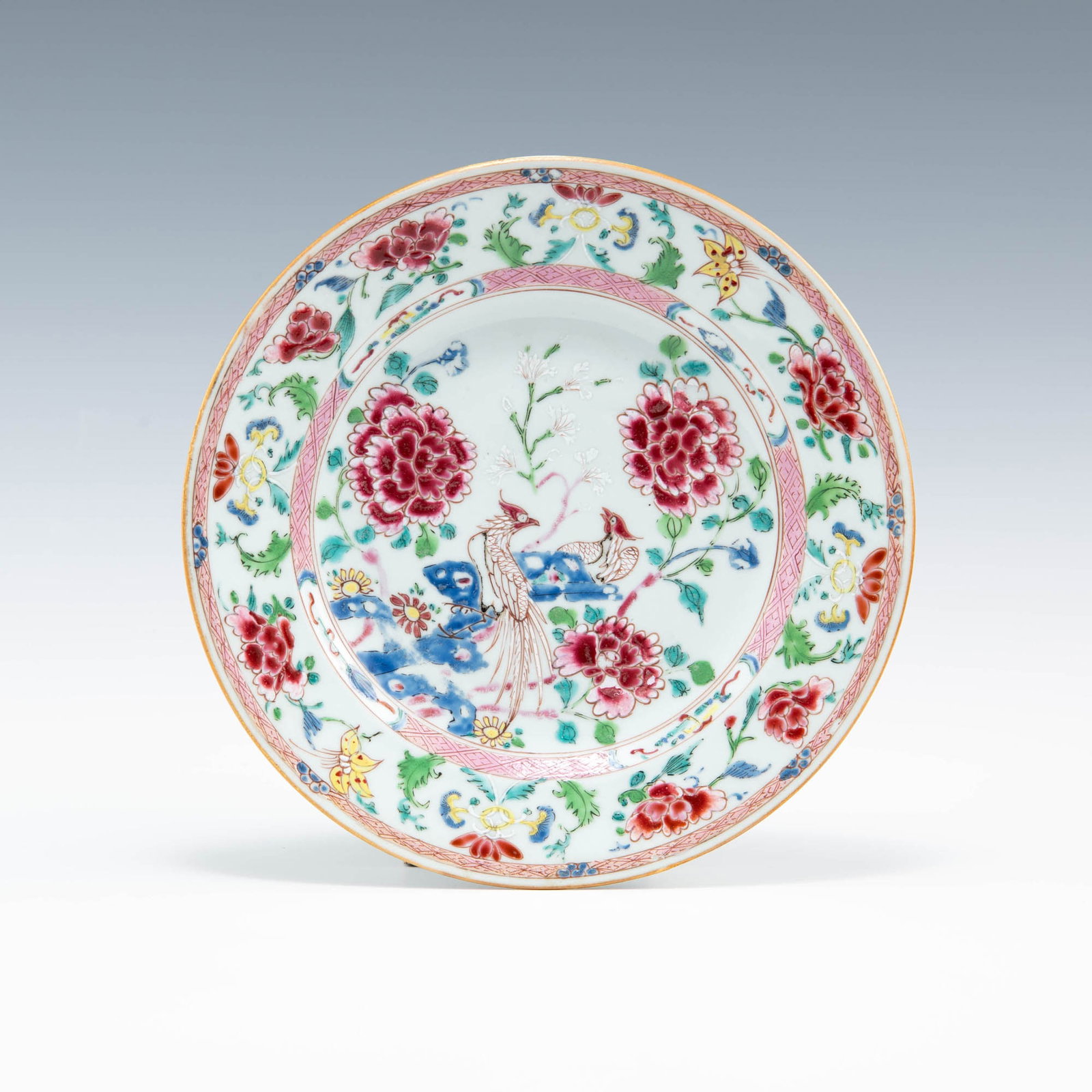 A Chinese export famille rose plate, 18th century: A Chinese export famille rose plate 18th century The interior centering a pair of phoenix surrounded by flowers. H: 1 1/8, Dia: 8 7/8 in. H: 2.86, Dia: 22.54 cm. Provenance: Collection of Mr. Williams