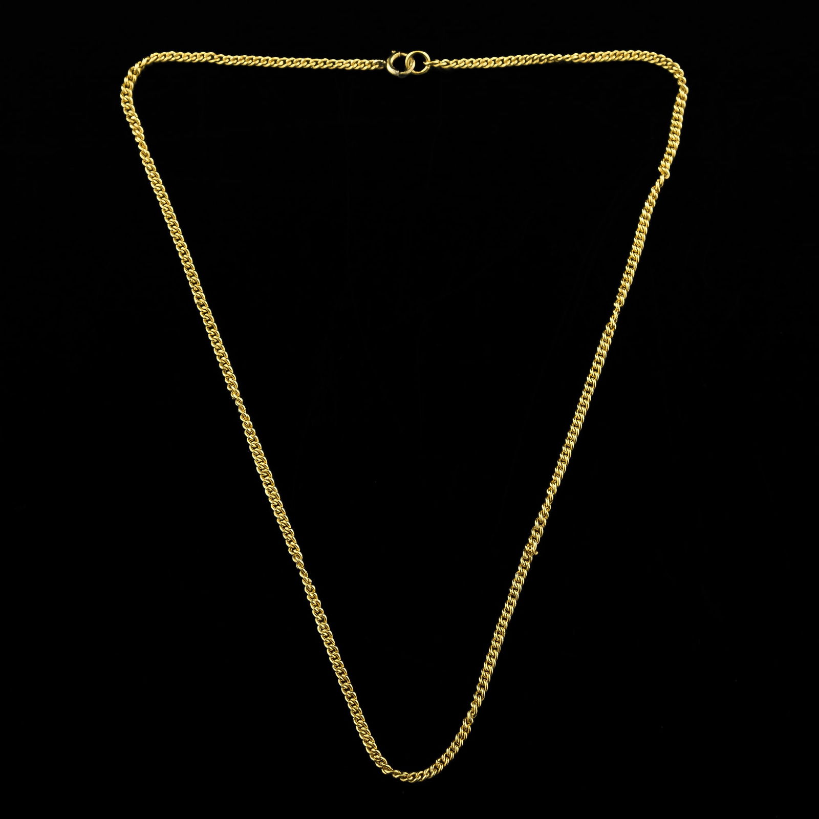 A Chinese gold chain necklace, early 20th century: A Chinese gold chain necklace early 20th century The clasp engraved with indiscernible mark. L: 14 3/4 in. L: 37.46 cm. Weight: 7.67 g (approximately) Provenance: Mr. Lau, Honolulu, Hawaii. Acqu
