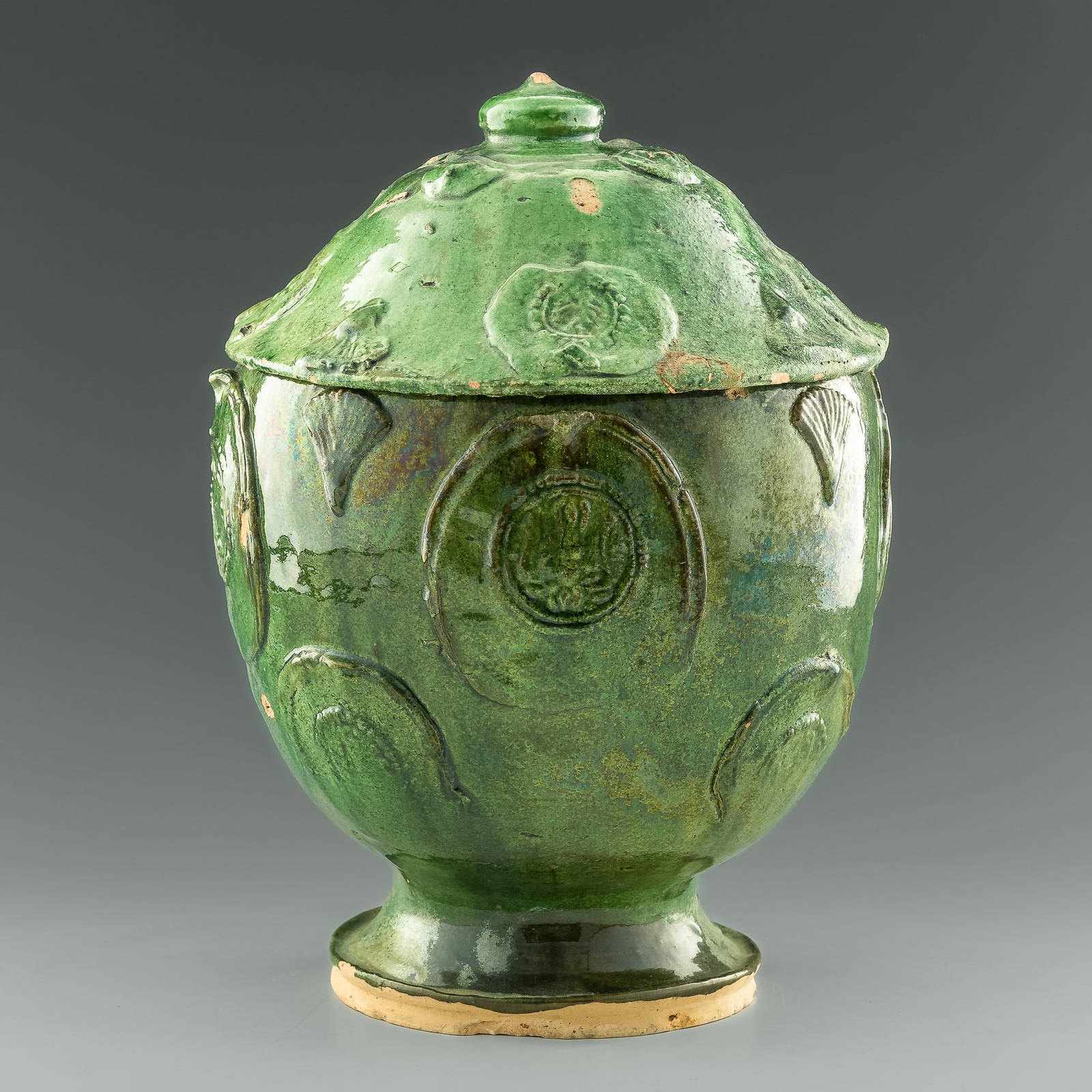 A Chinese Greenglazed Lidded Lotus Jar, Yuan Dynasty Auction