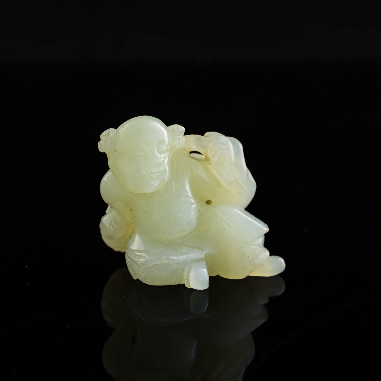 A Chinese carved white jade 'boy' figurine, 19th century (1 of 7)