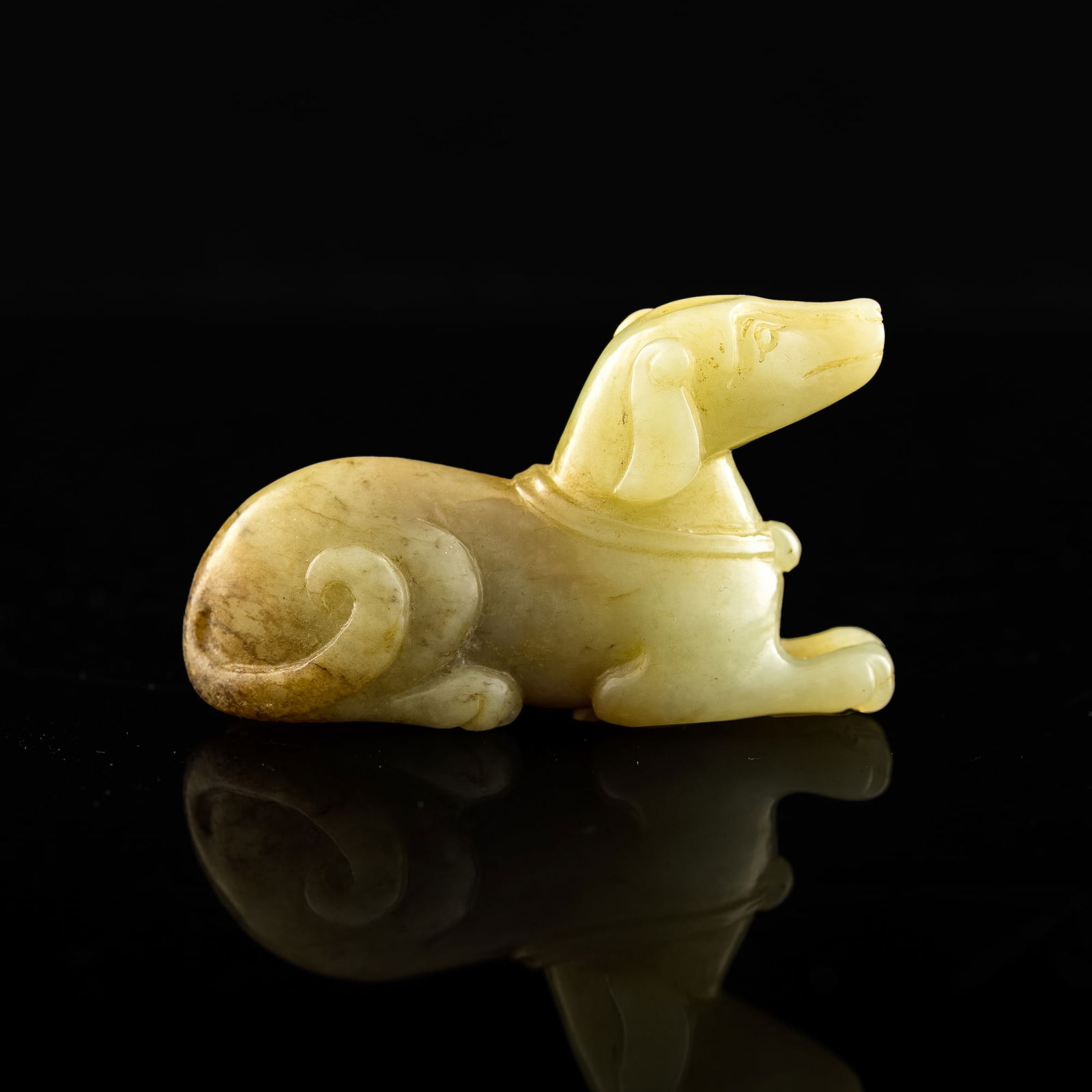 A Chinese carved jade figure of a dog, 18th century or earlier: A Chinese carved jade figure of a dog 18th century or earlier H: 1 3/4, W: 2 7/8, D: 1 in. H: 2.54, W: 7.94, D: 4.75 cm. Provenance: Mr. Perry, Central Louisiana. Acquired his collection in Asia from