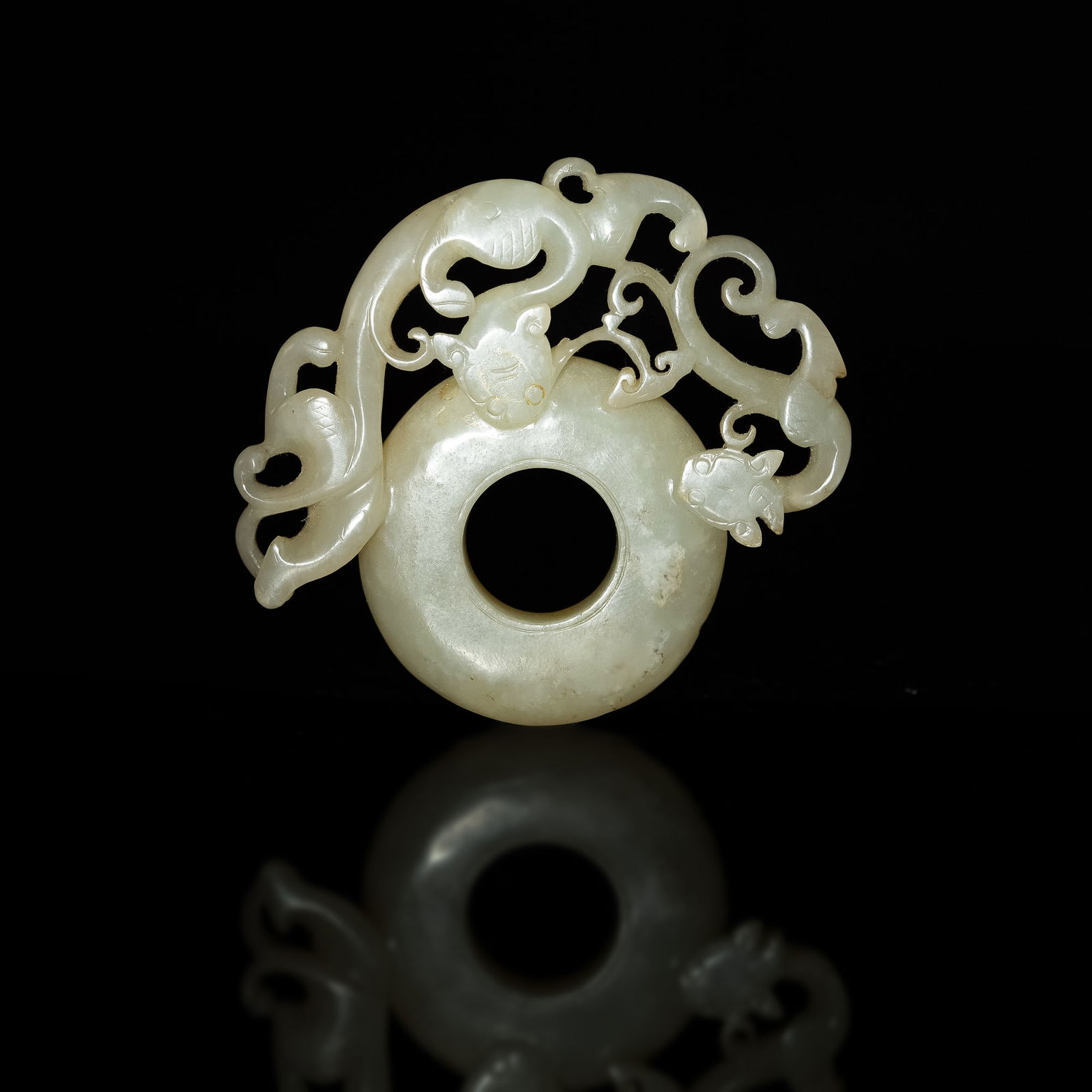 A Chinese carved jade 'chilong' bi, Ming dynasty (1 of 3)