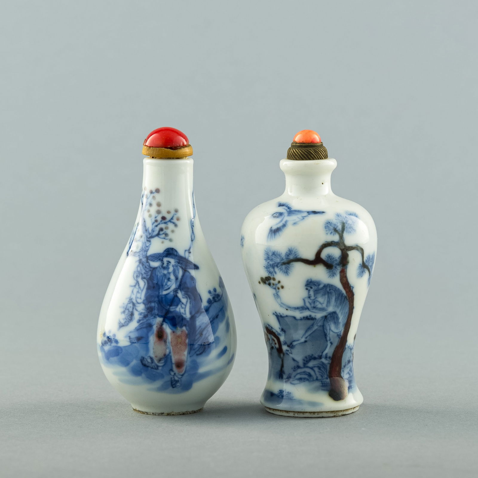 Two Chinese copper-red and blue underglaze-decorated 'landscape' snuff bottles, 19th century (1 of 8)