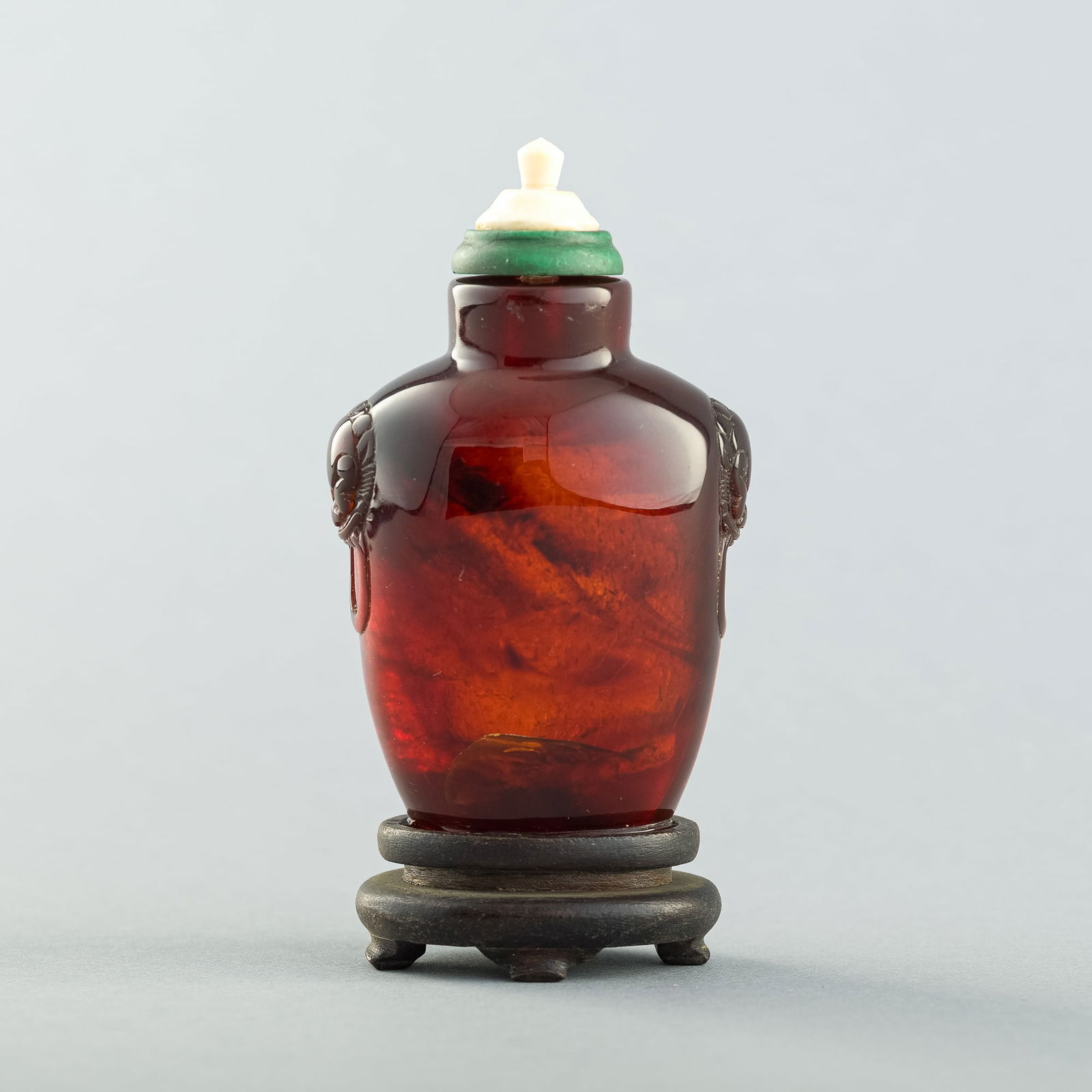 A Chinese carved amber snuff bottle, 18th century (1 of 9)