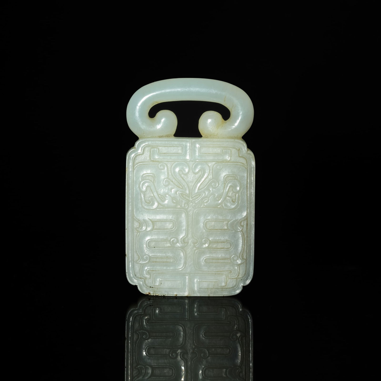 A Chinese carved white jade toggle, 18th century (1 of 7)