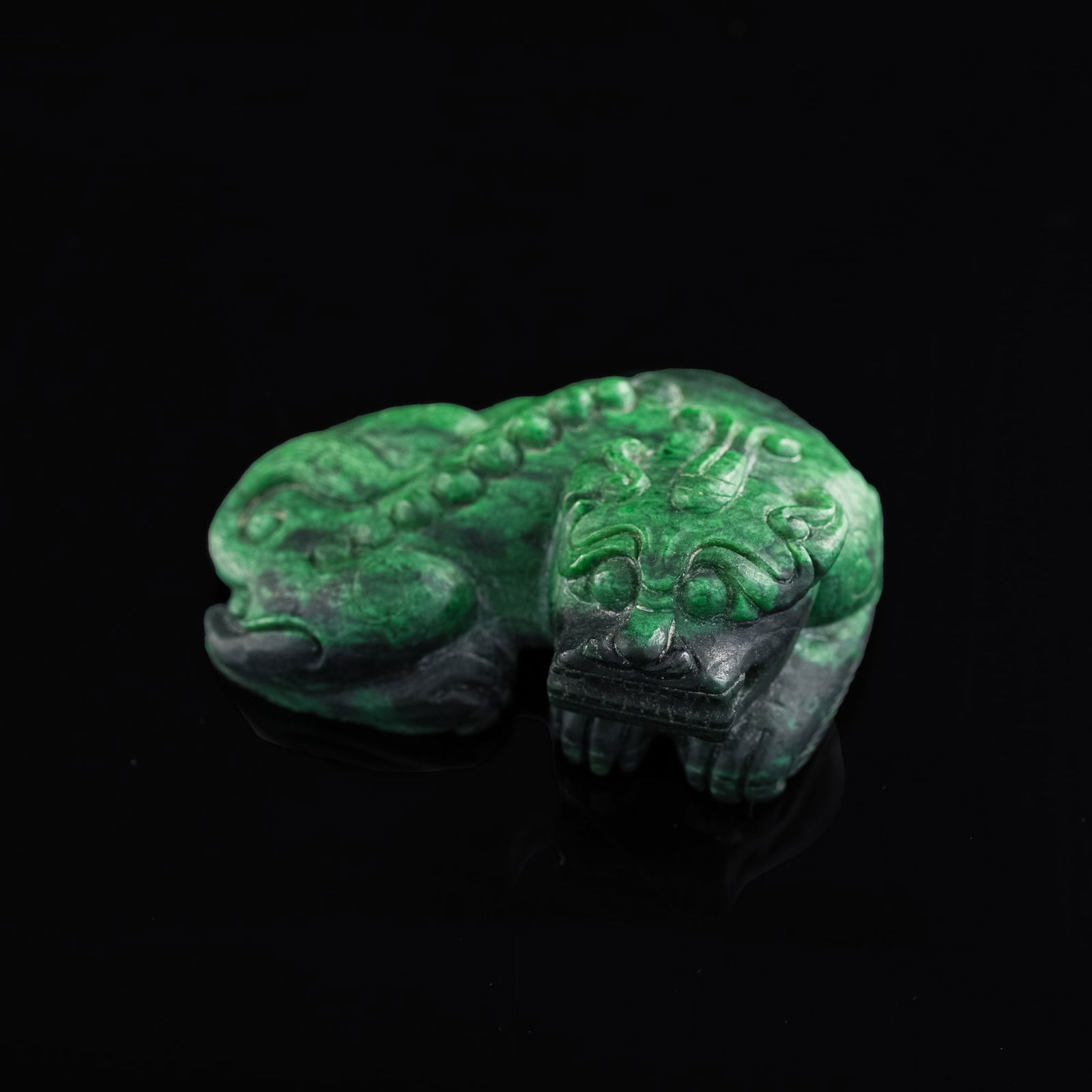A Chinese carved malachite beast-form paper weight, Qianlong period, Qing dynasty (1 of 10)