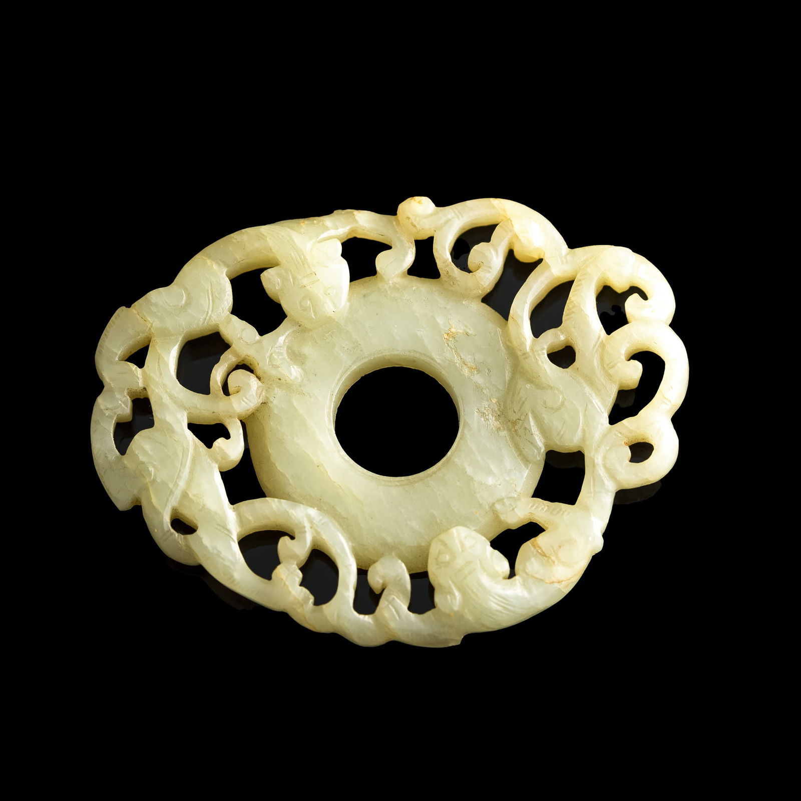 A Chinese carved jade 'chilong' bi, Ming dynasty (1 of 5)