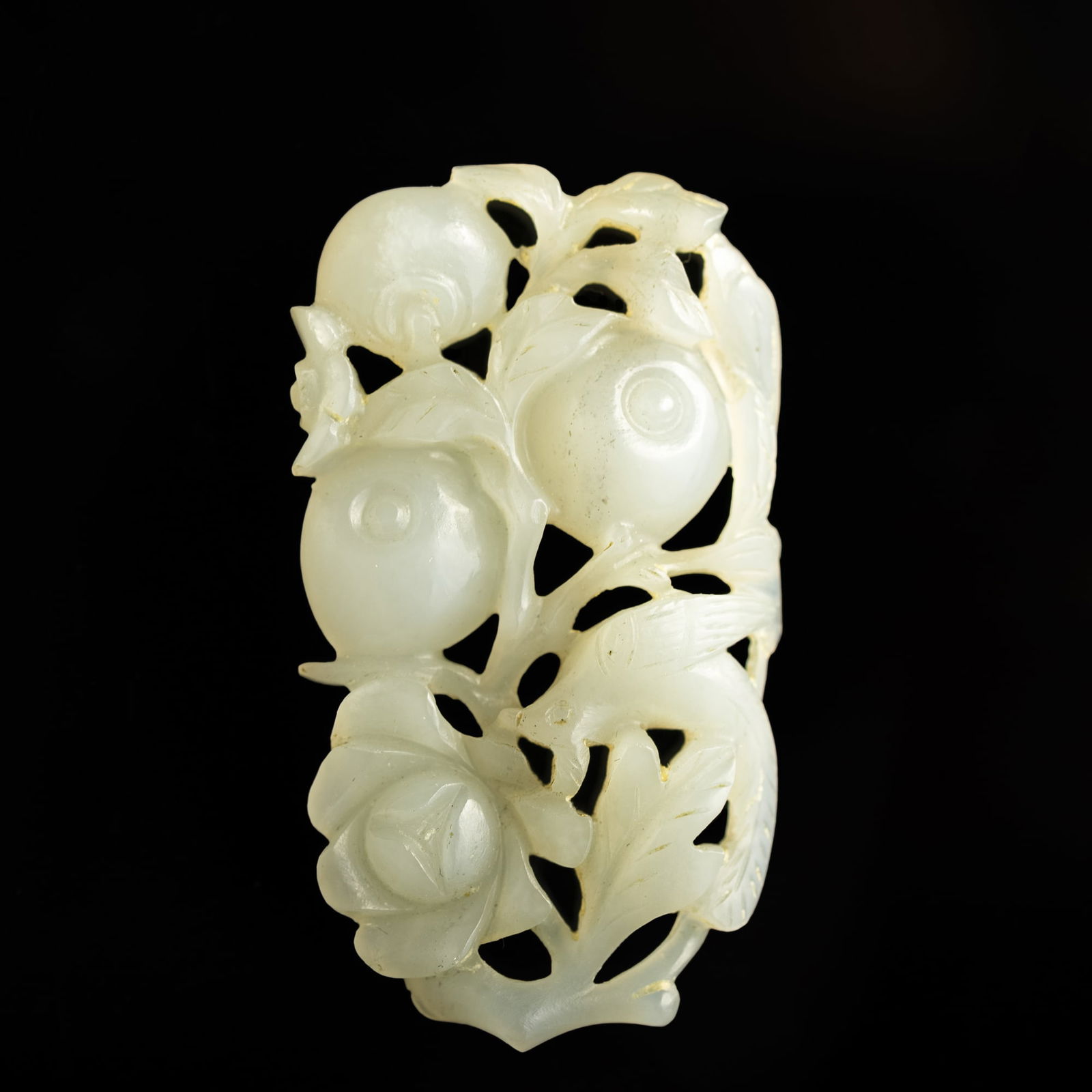 A Chinese carved white jade 'persimmon' toggle, 18th century (1 of 7)
