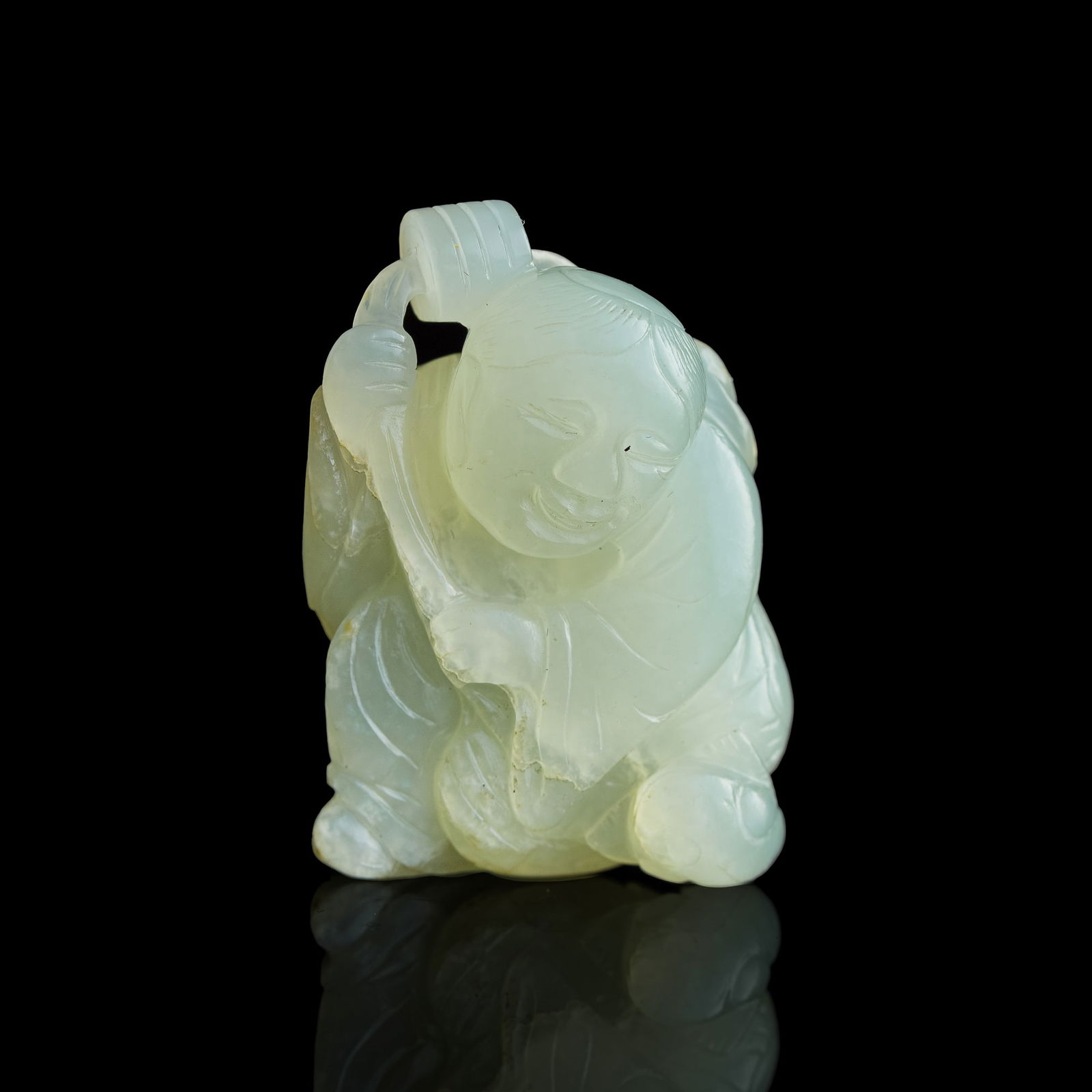 A Chinese carved jade 'boy' pendant, 19th century (1 of 7)