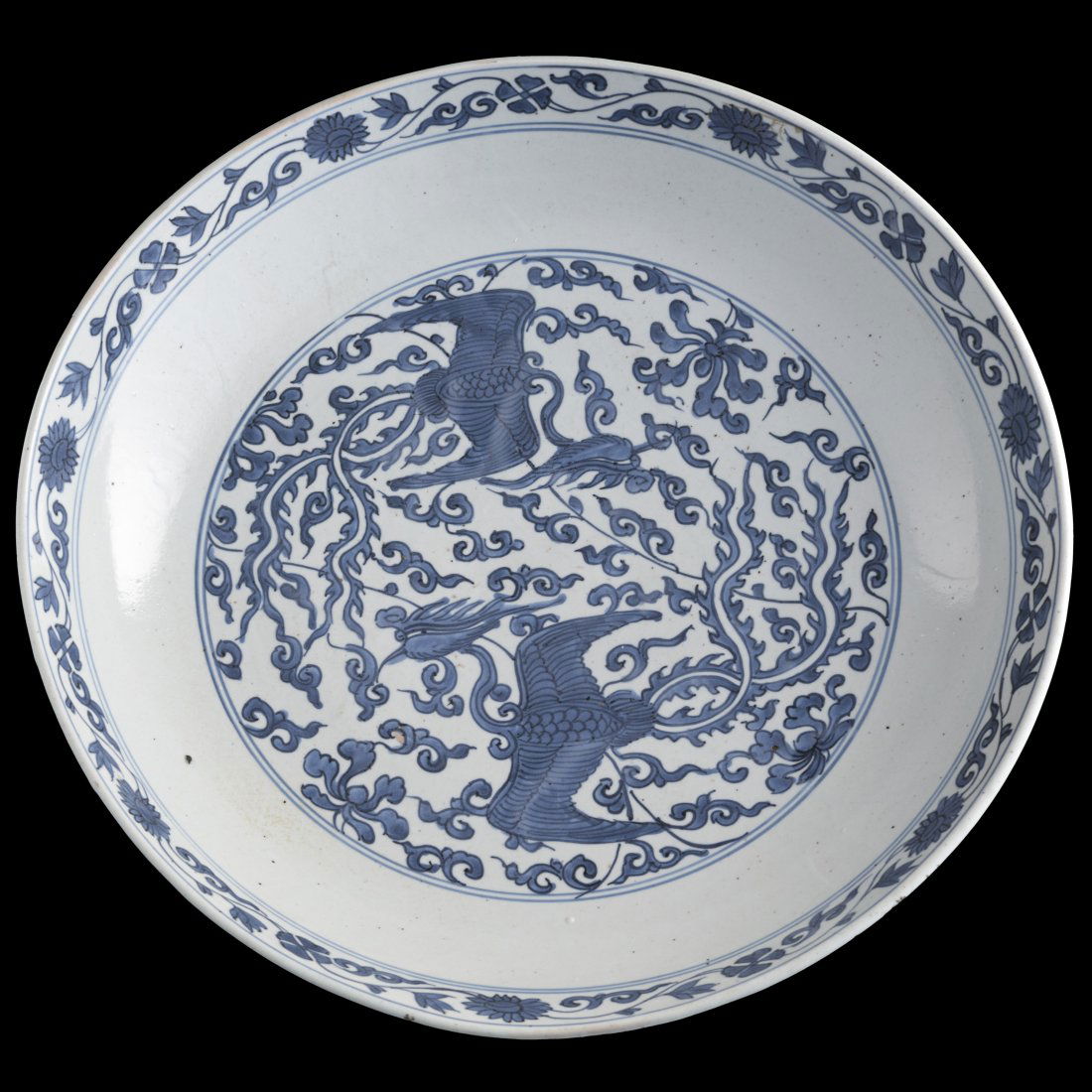 A large Chinese blue and white 'phoenix' plate, 16th century (1 of 9)