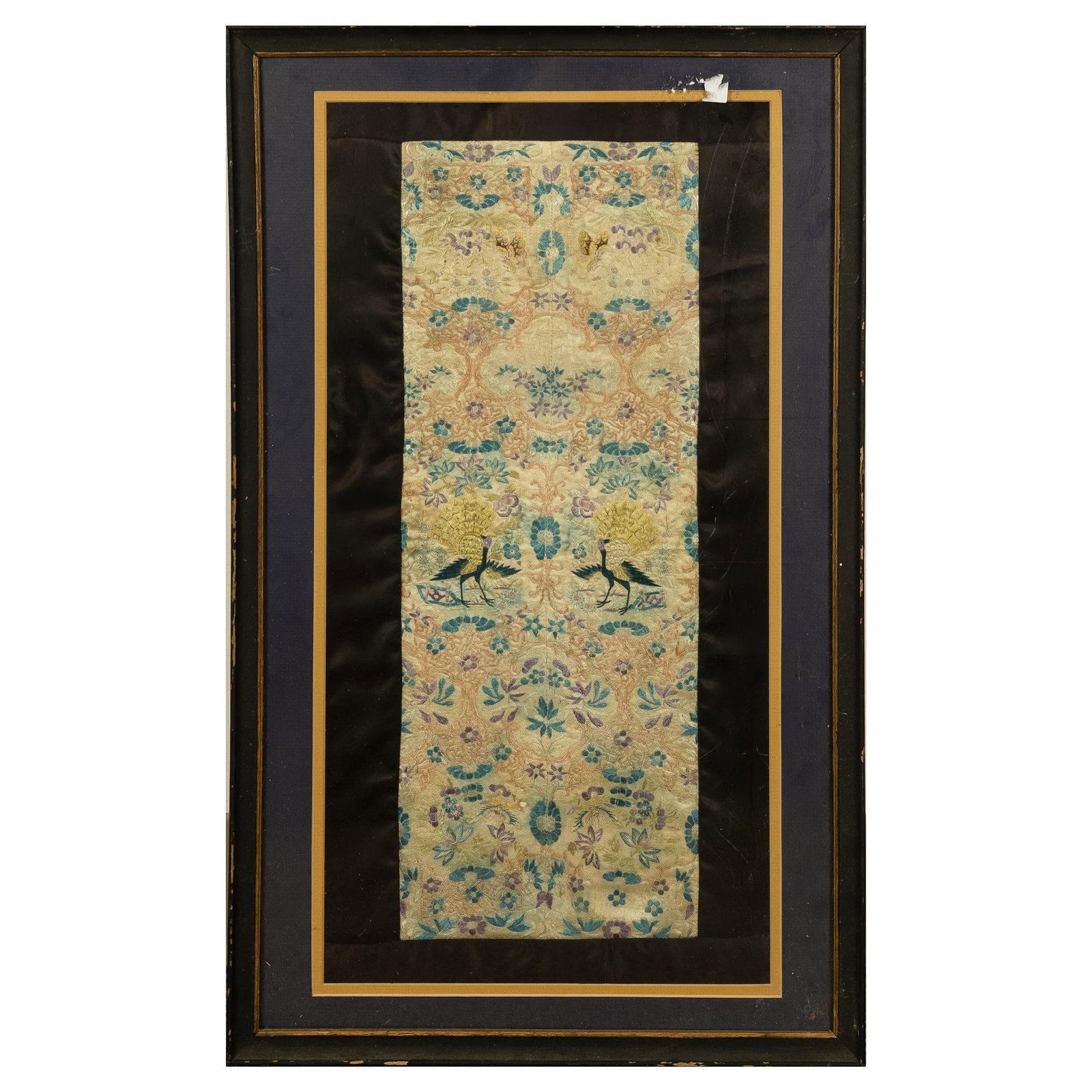 A Chinese embroidered cuff with floral and bird design, 19th century: A Chinese embroidered cuff with floral and bird design 19th century Featuring two peacocks surrounded by symmetrical floral design; framed. H: 19 1/4, W: 7 1/4 in. (H: 48.90, W: 18.42 cm. (sight)) Pro