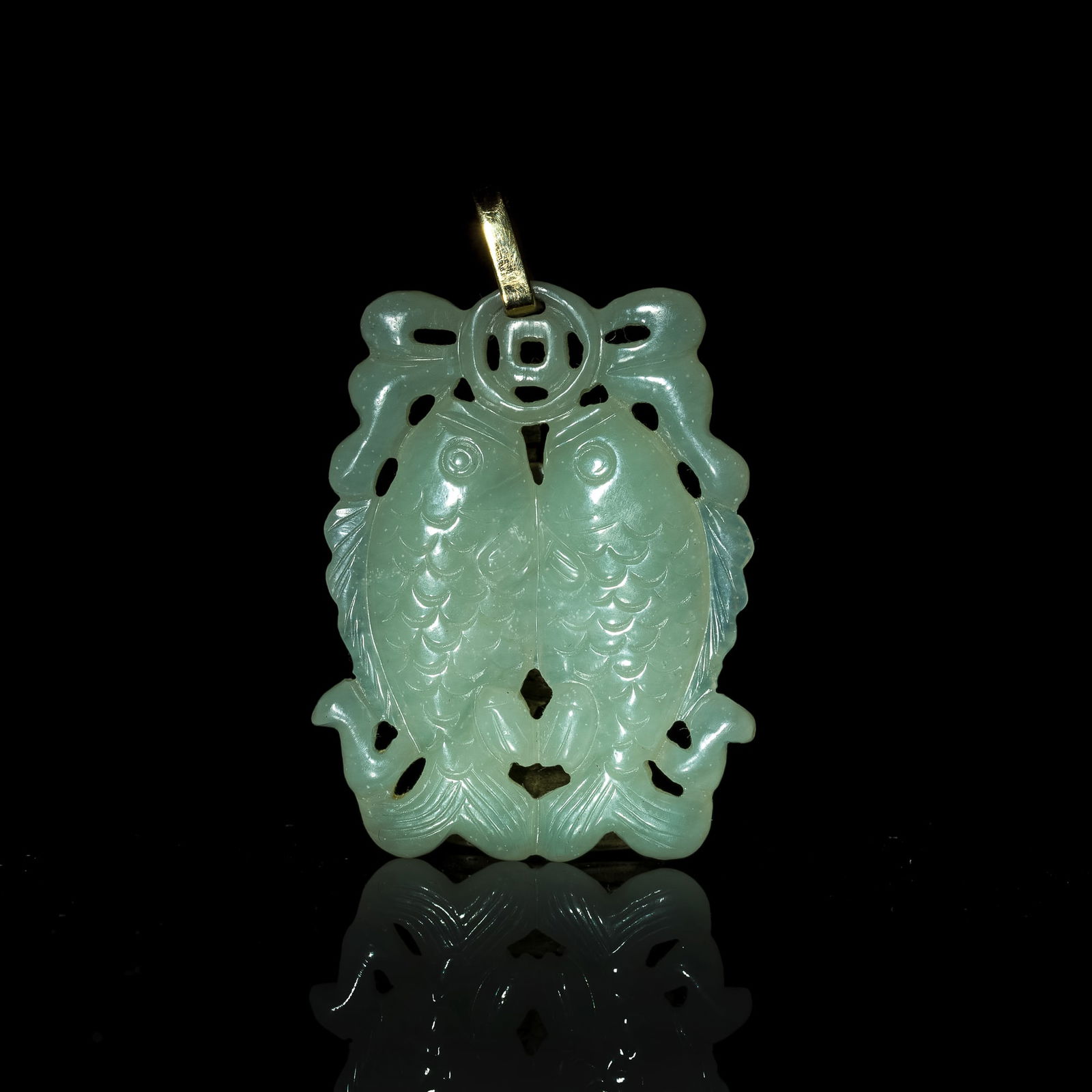 A Chinese carved jade 'double fish' plaque, 19th century (1 of 5)