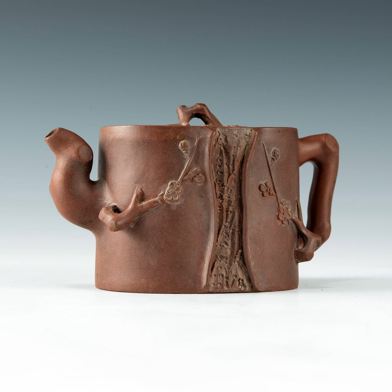 A Chinese zisha teapot, 19th-early 20th century: A Chinese zisha teapot 19th-early 20th century The teapot features flowering branches on body and finial. With two-character artist signature of Shao Youting to underside of lid, mark to underside of 