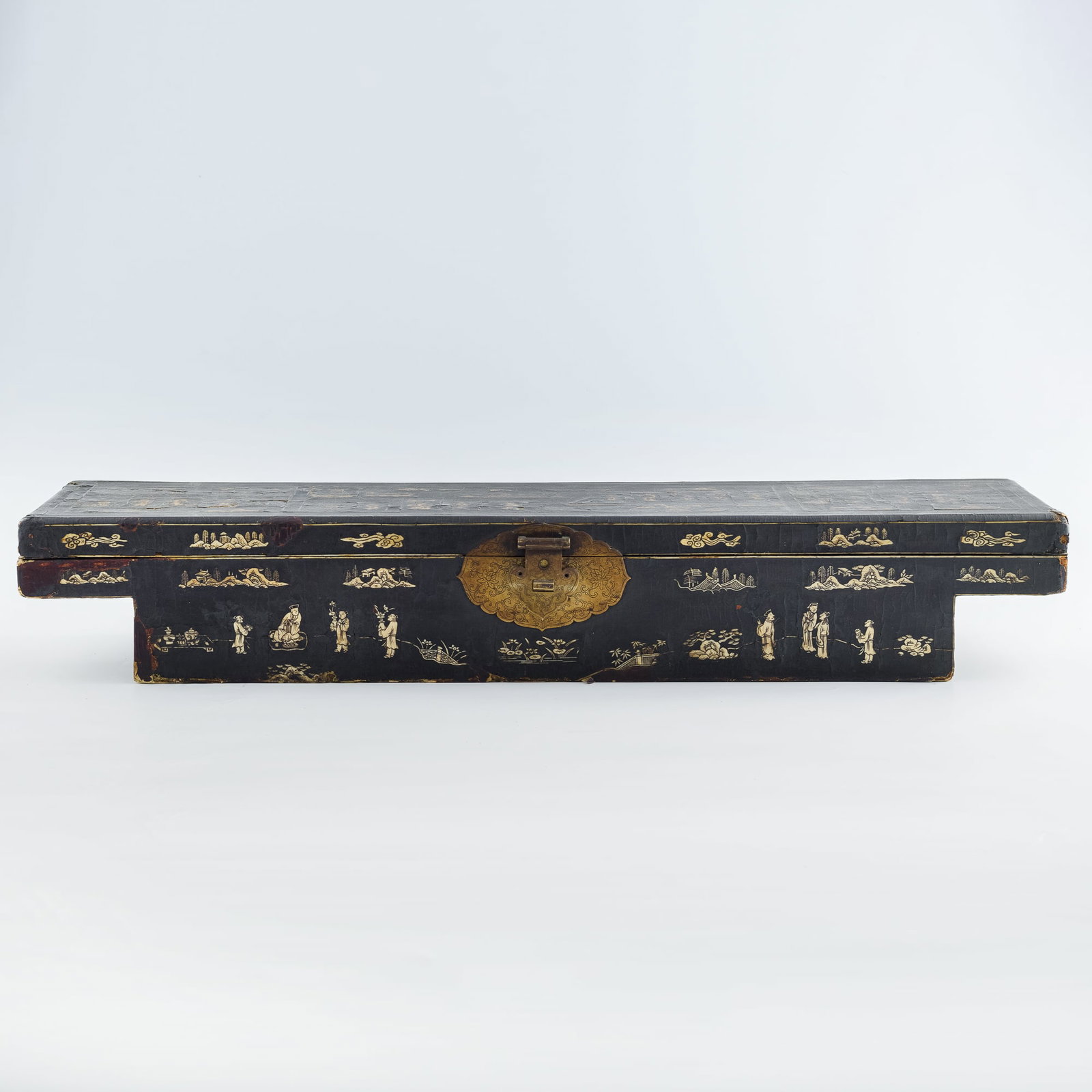 A Chinese black lacquer sedan chair box with carved 'figural' bone inlays, Ming dynasty: A Chinese black lacquer sedan chair box with carved 'figural' bone inlays Ming dynasty With long rectangular top and narrower bottom, a red lacquer interior, and a ruyi-form lockplate. This box was de