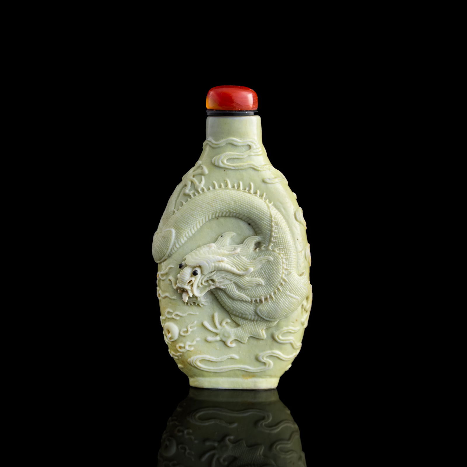 A Chinese monochrome-glazed molded porcelain snuff bottle, 19th century (1 of 8)