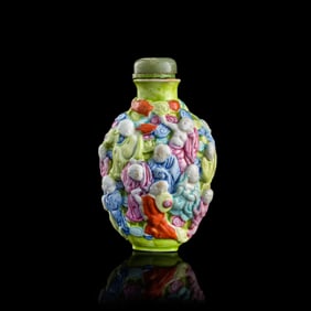 A Chinese famille rose molded porcelain snuff bottle, 19th century