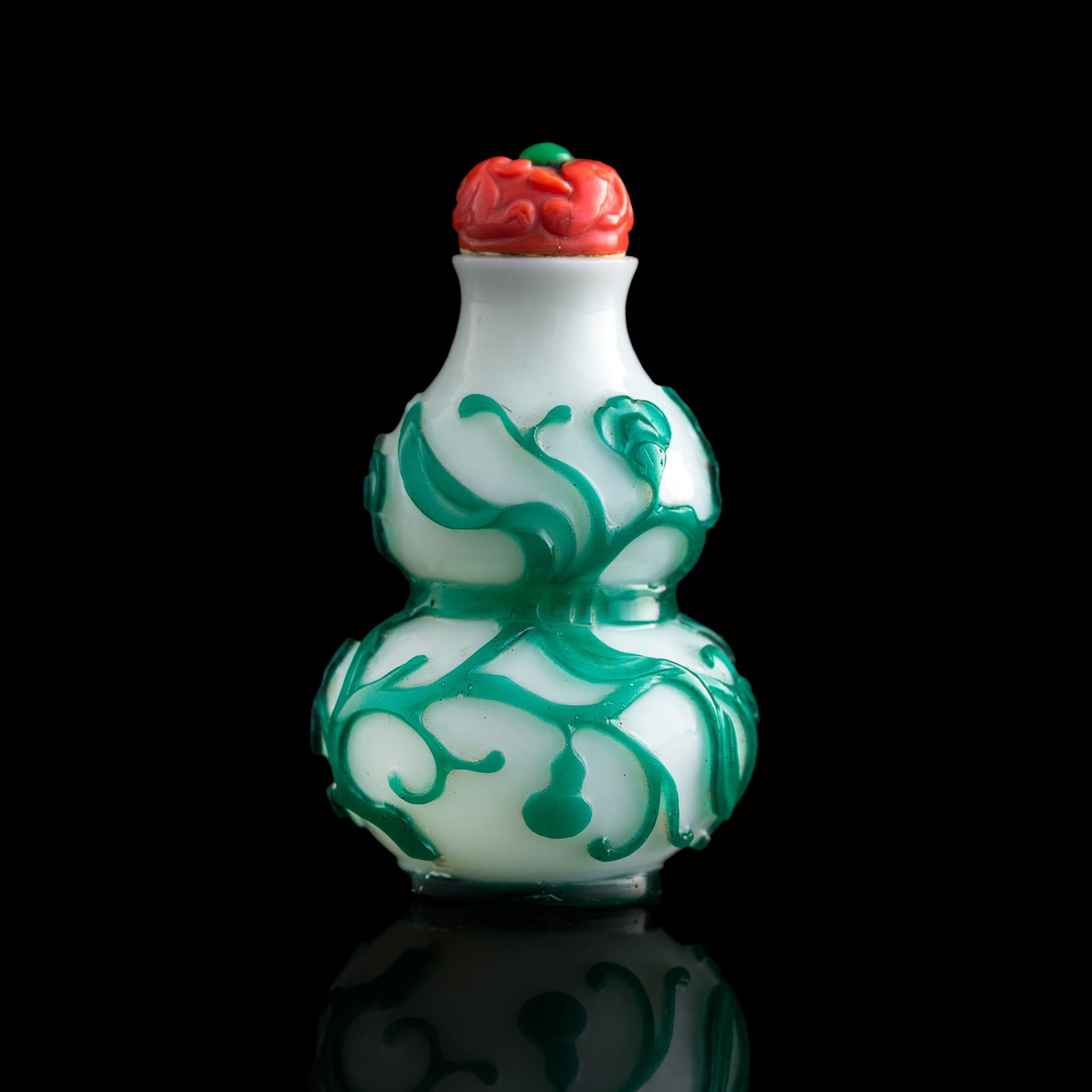 A Chinese green-overlay white Peking glass hulu-form snuff bottle, 18th century (1 of 8)
