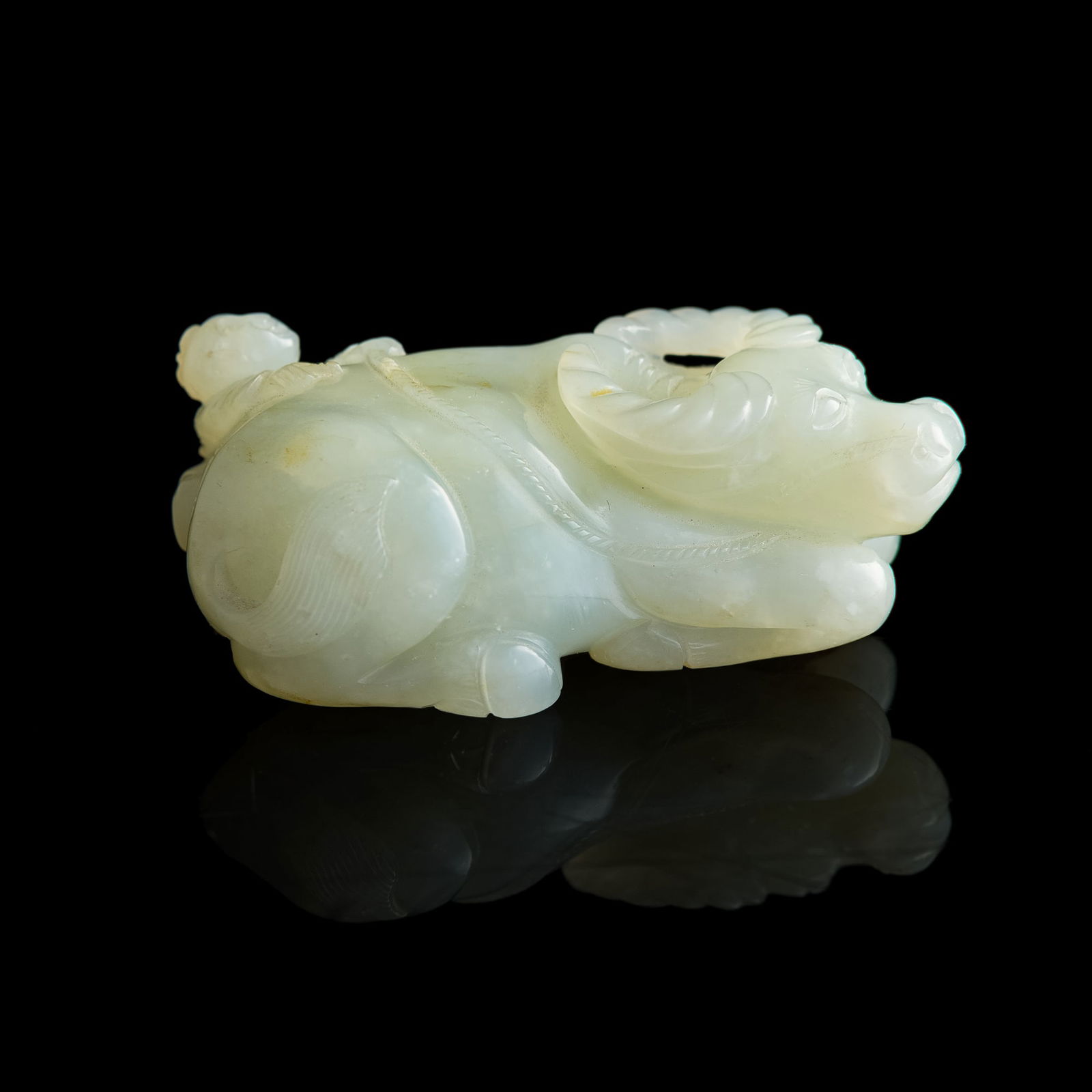 A Chinese white jade 'boy on buffalo' toggle, 19th century (1 of 8)